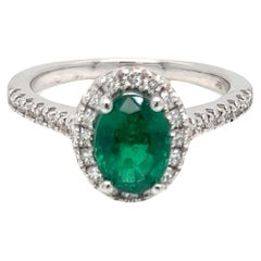 Used 1.87 Carat Oval cut Emerald and Diamond Halo Engagement Ring 