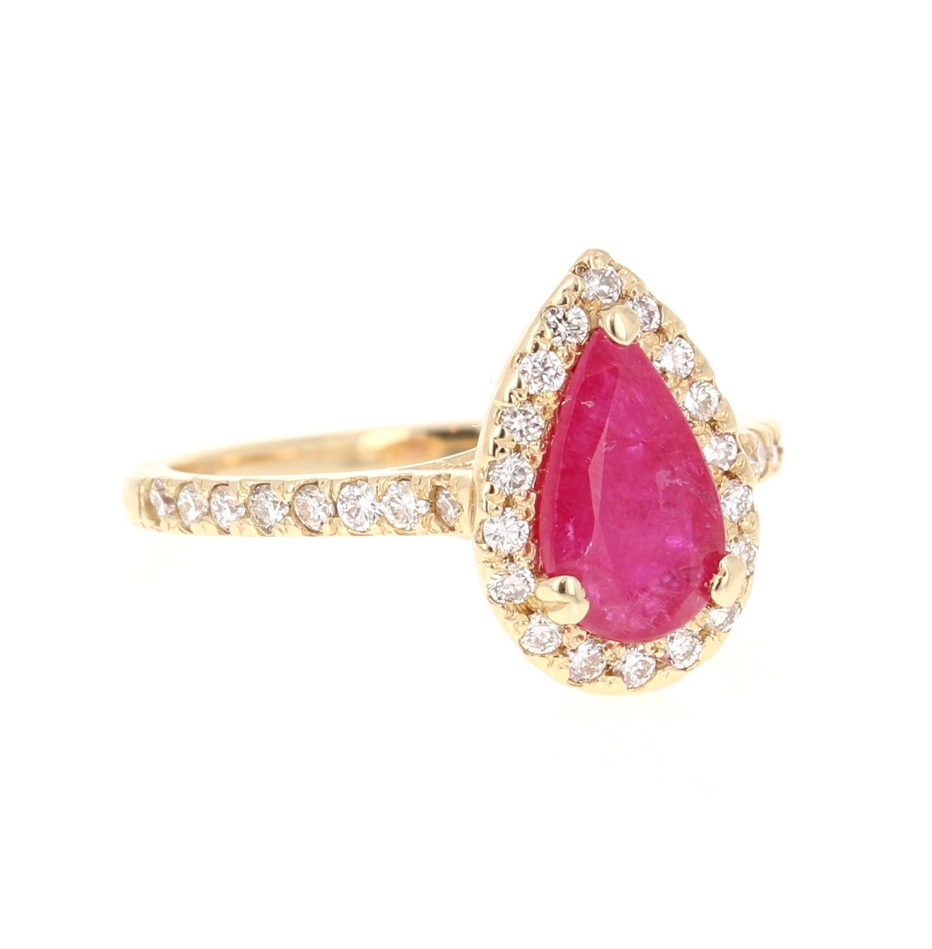 A simple yet beautiful ring with a 1.18 Carat Pear Cut Ruby as its center and 36 Round Cut Diamonds that weigh 0.69 carats. (Clarity: VS, Color: H) The total carat weight of the ring is 1.87 Carats. The Ruby measures at 6 mm x 9 mm and the face of
