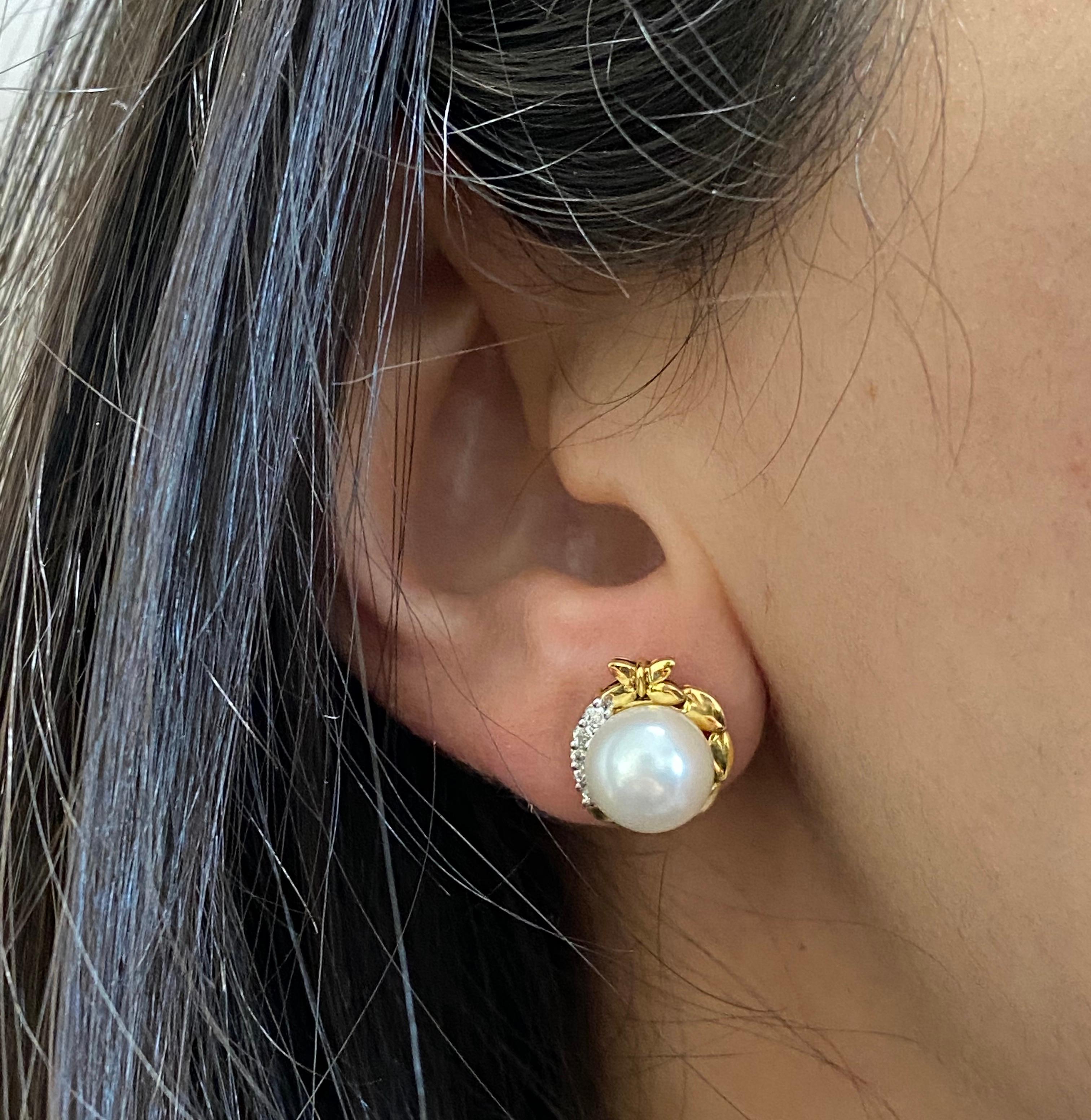 Material: 18K Yellow Gold 
Stone Details: 2 Round Pearls at 1.87 Carats 
Diamond Details: Brilliant Round White Diamonds at 0.14 Carats Total- Clarity: VS-SI / Color: H-I
This piece measures approximately 13 millimeters.

Fine one-of-a-kind