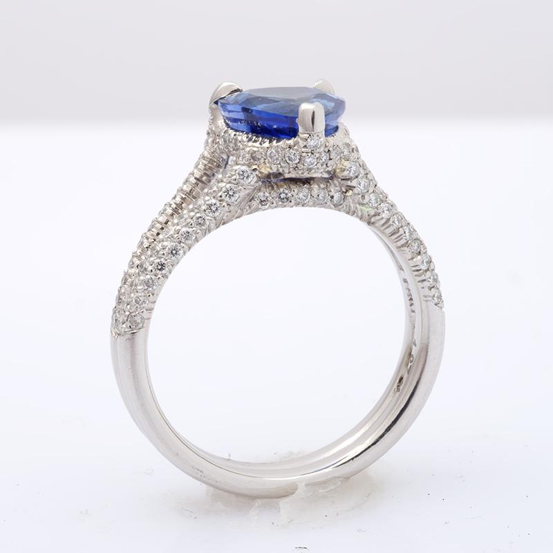 This outstanding heart shaped Sapphire has an unmatched cornflower blue color. Weighing 1.87 carats the gem has retained both weight and color, which are extremely difficult to achieve. Set in platinum the central sapphire has been supported by arms