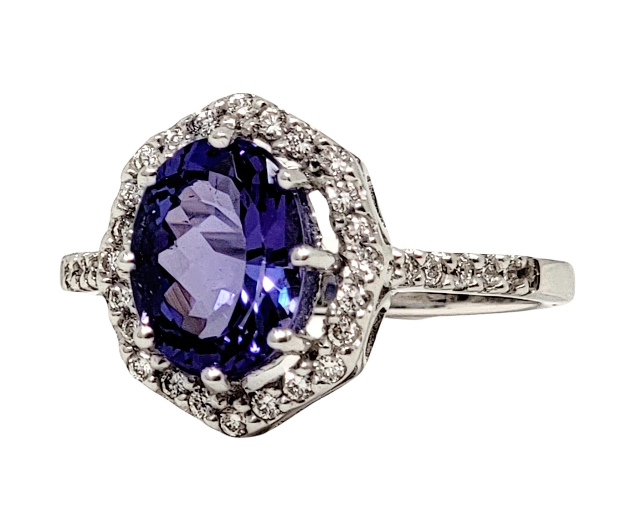 Contemporary 1.87 Carats Total Oval Tanzanite and Diamond Halo Ring in 18 Karat White Gold For Sale