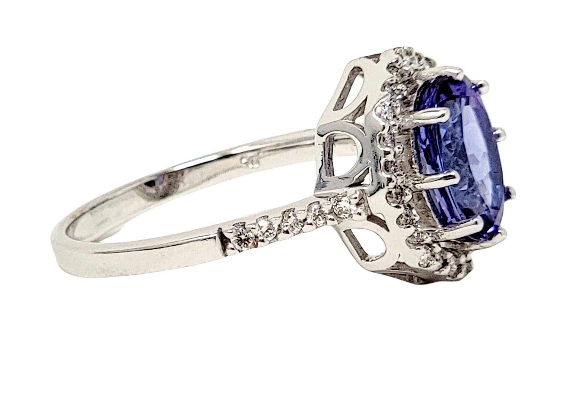 Oval Cut 1.87 Carats Total Oval Tanzanite and Diamond Halo Ring in 18 Karat White Gold For Sale