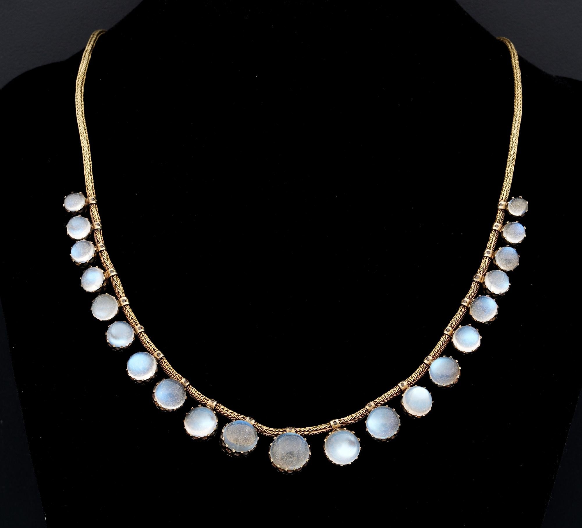 Victorian Celestial Must!

Rare 1870 ca Victorian necklace of understated elegance
Superbly hand crafted of solid 18 KT gold – snake chain from which hang 21 Celestial antique round cabochons - Sri Lanka origin - shimmering Moonstones with Blue