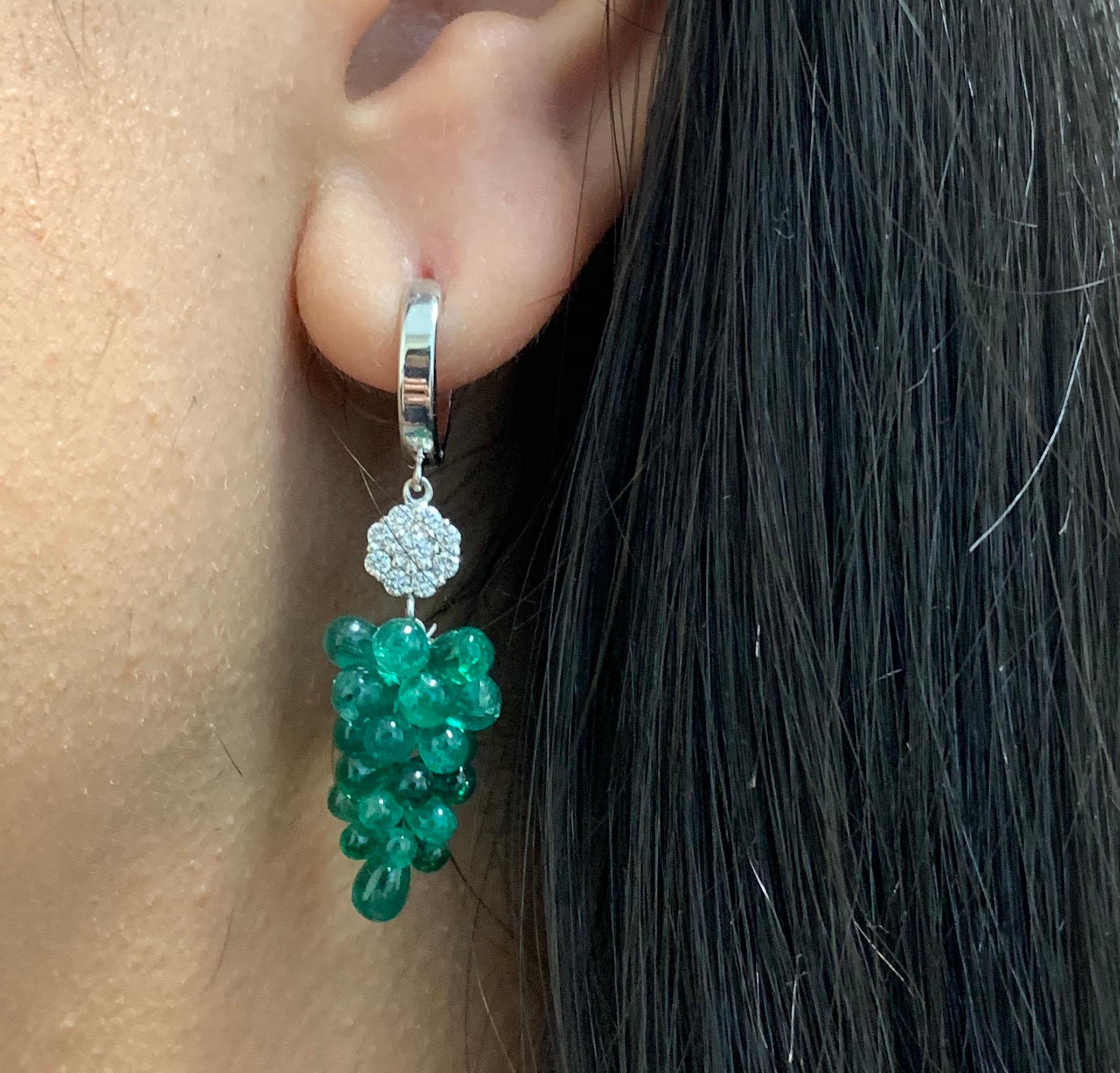 Material: 14k White Gold 
Stone Details: 2 Briolette Emeralds at 18.70 Carats Total
Diamond Details: 18 Round White Diamonds at 0.42 Carats Total- Clarity: SI / Color: H-I

Fine one-of-a-kind craftsmanship meets incredible quality in this