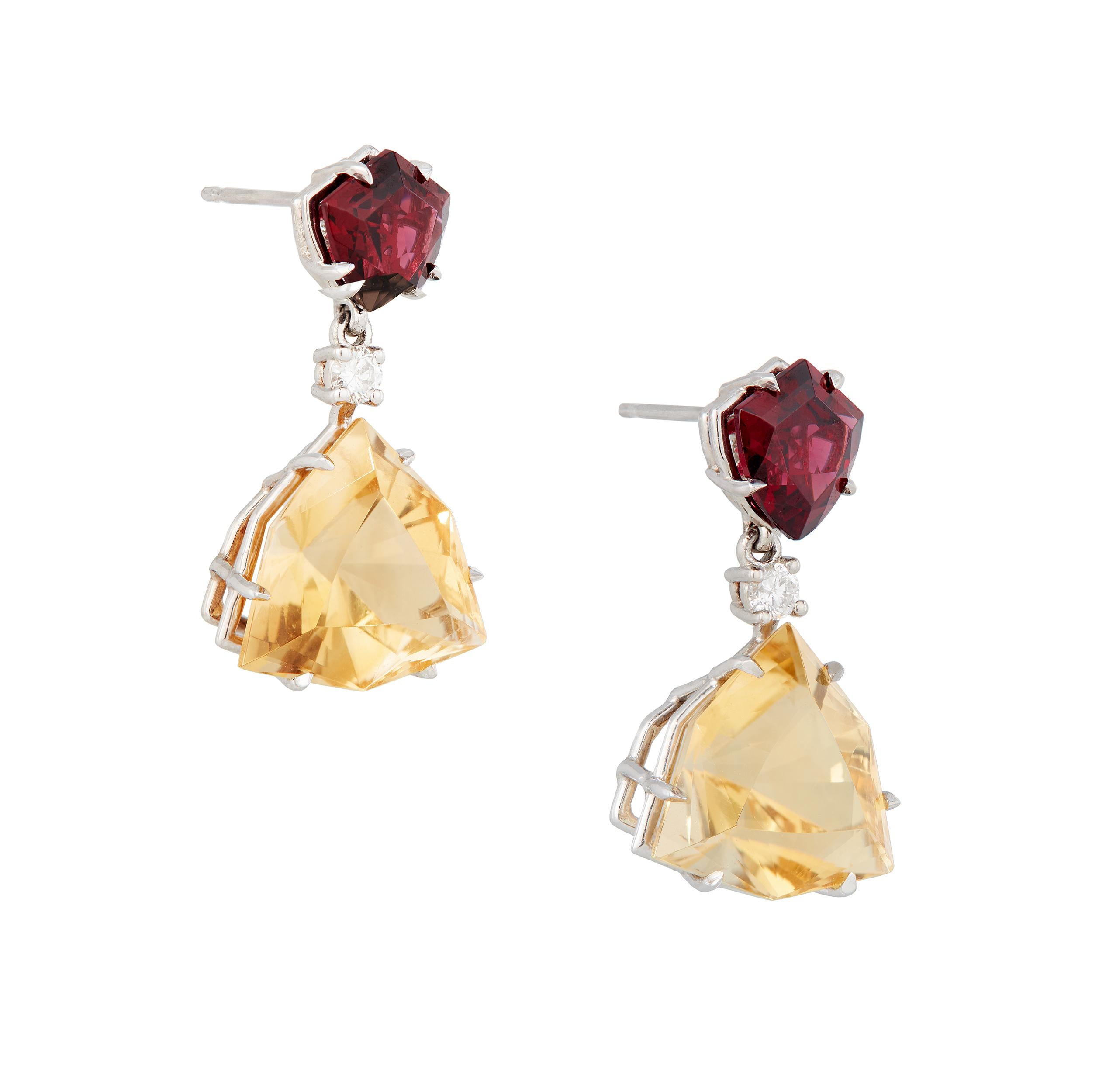 With Modified Shield-shaped gemstones, these earrings have their own kind of noble and powerful presence. The color combination of Garnet  and this Honey-colored Citrine are sublime together.

Shield-shaped Garnets (2) 2.9 Carats
Modified