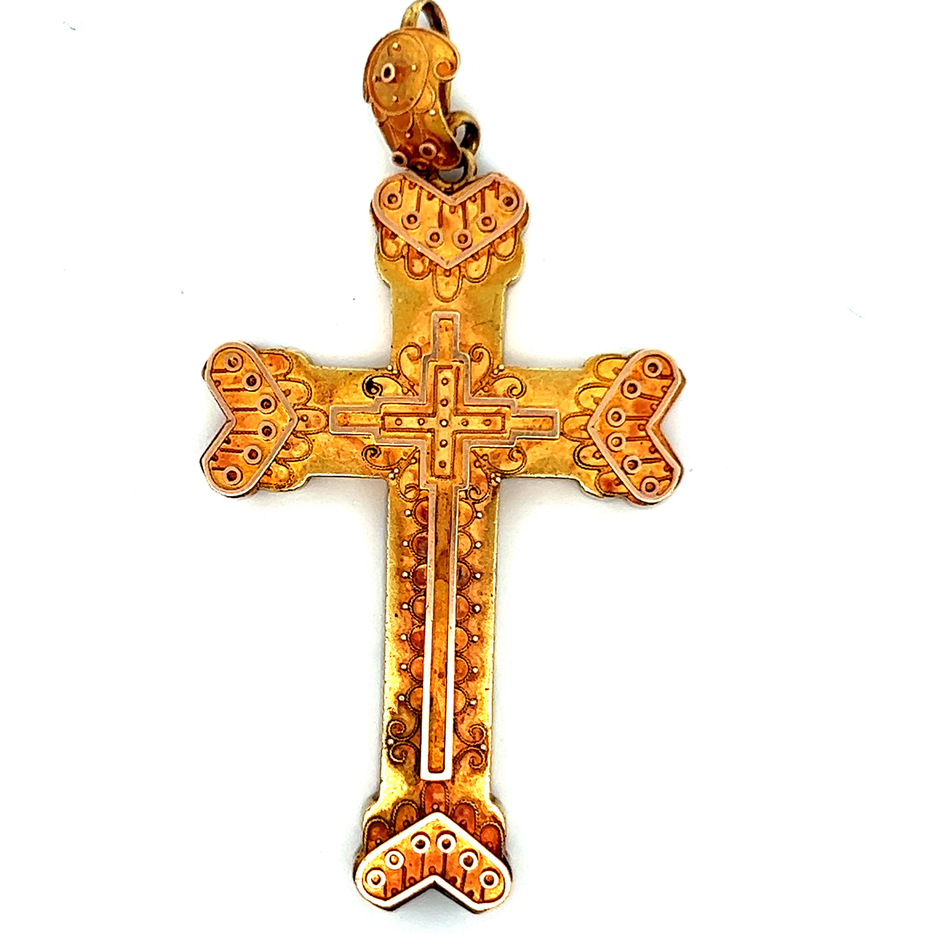 This lovely cross/pendant is 1870 Etruscan and is made in 14k yellow gold. This cross contains beautiful engravings all over the cross providing exquisite detail and design. This cross also features a large bale at the top of the cross so this cross