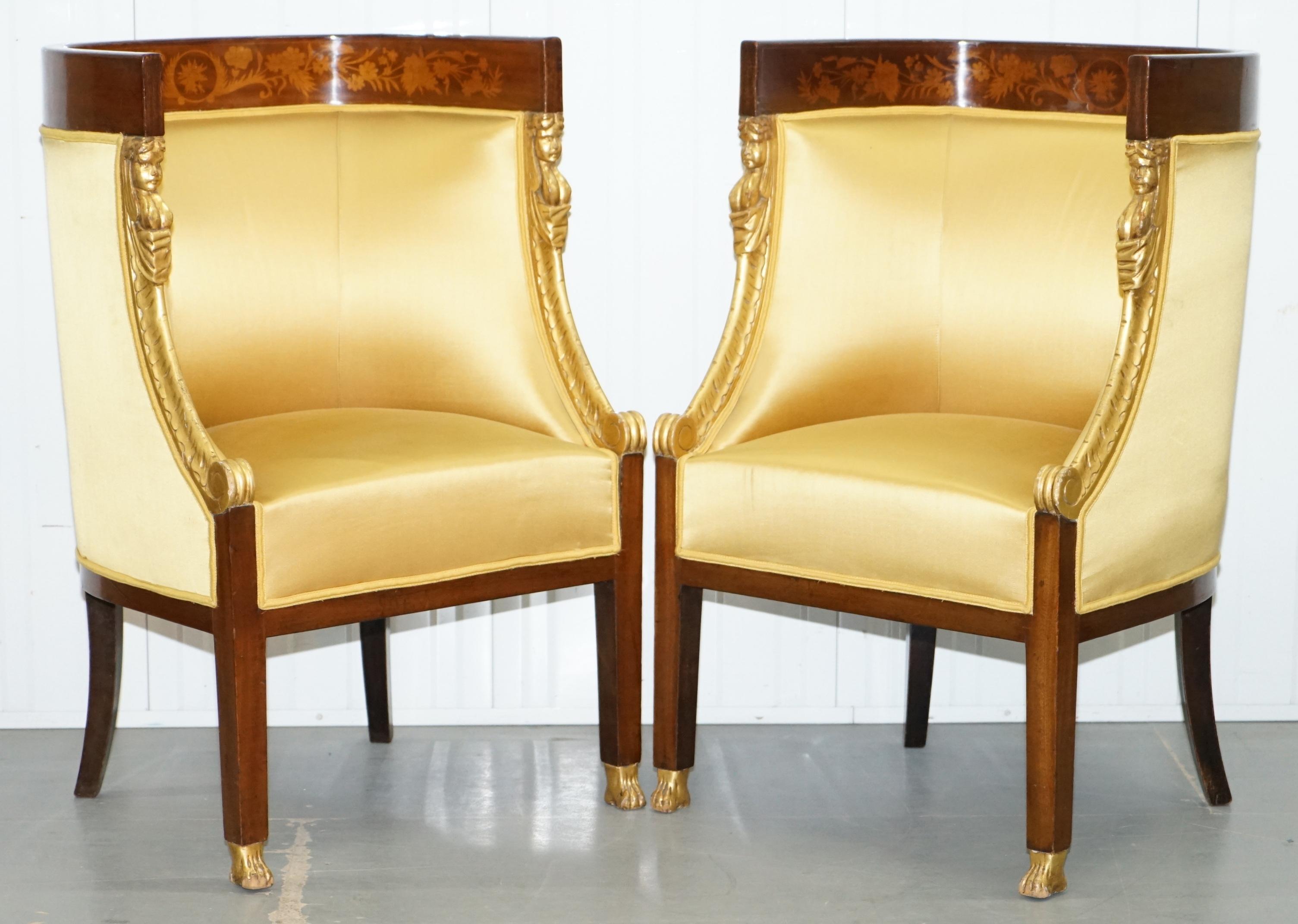 We are delighted to offer for sale this stunning French marquetry inlaid circa 1870 Empire style three piece suite with neoclassical detailing

A very rare and good looking set, the frames are mahogany with hand carved inlay to the curved backs,