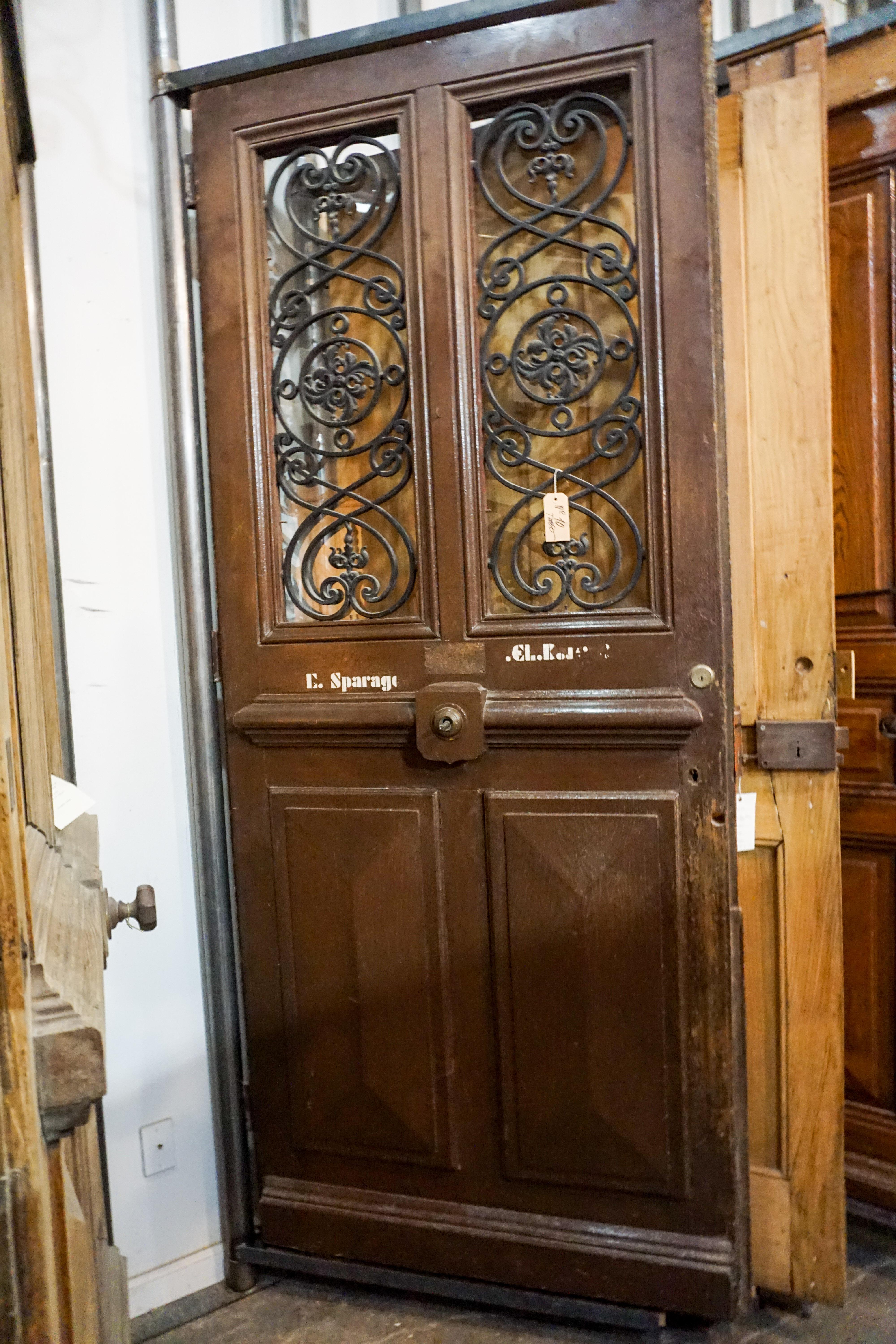 Unique single center pull oak door with ironwork.

Origin: France, circa 1870

Measurements: 41 1/4
