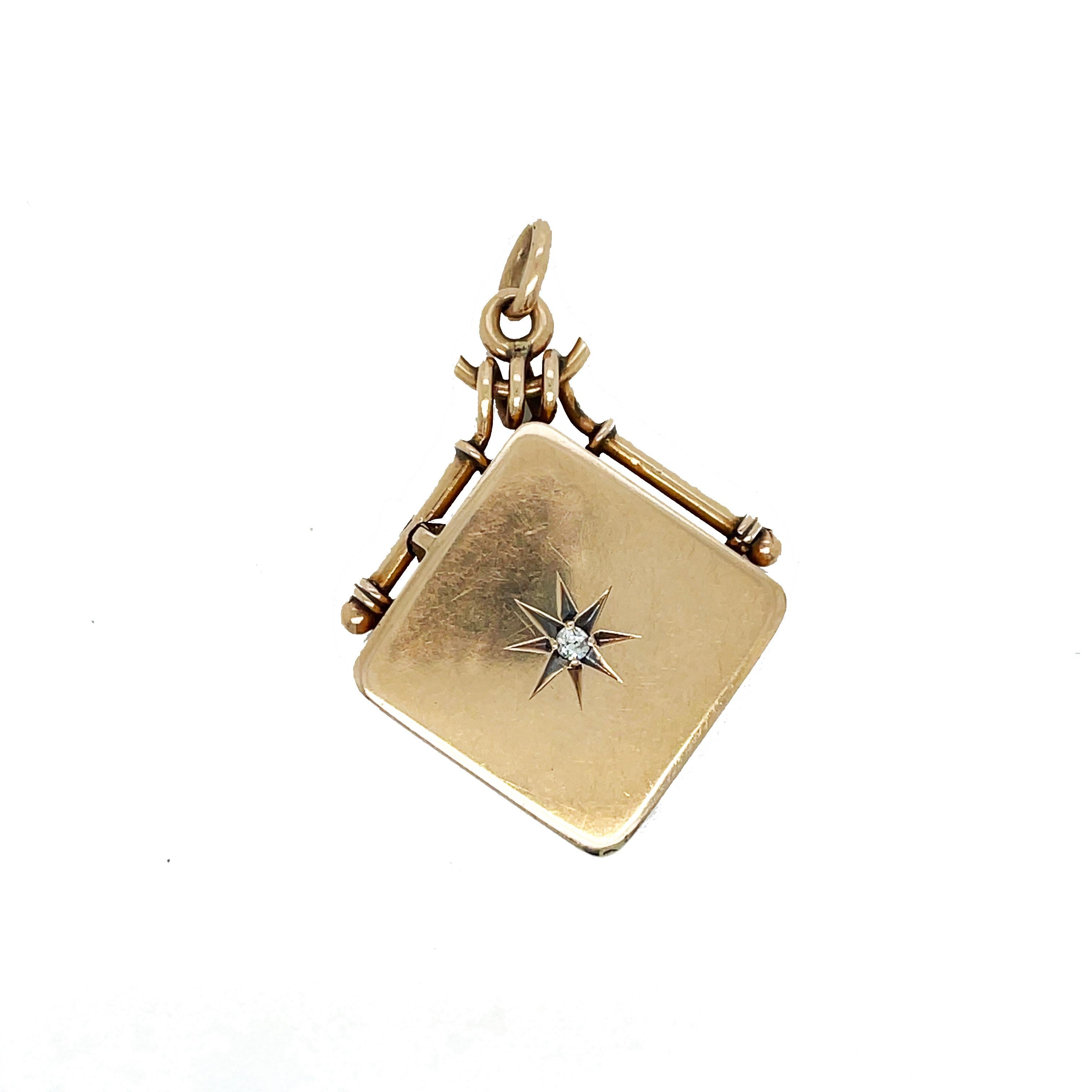This is a lovely Victorian watch fob locket set in 10K rose gold that features a lovely star set old mine cut diamond! This locket would make a beautiful addition to any jewelry collection and is a gorgeous and timeless piece of jewelry. At the