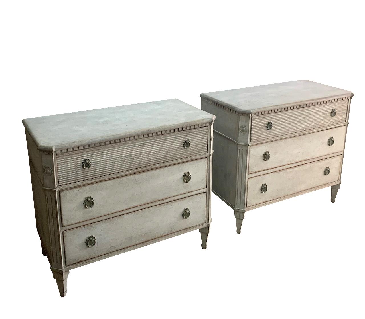 1870c Swedish pair of Gustavian style commodes.
Light grey in color.
Three drawers.
Top drawer with decorative reed design.
Dental molding along cornice.
Original hardware.
Newly completely restored.
ARRIVING MARCH.