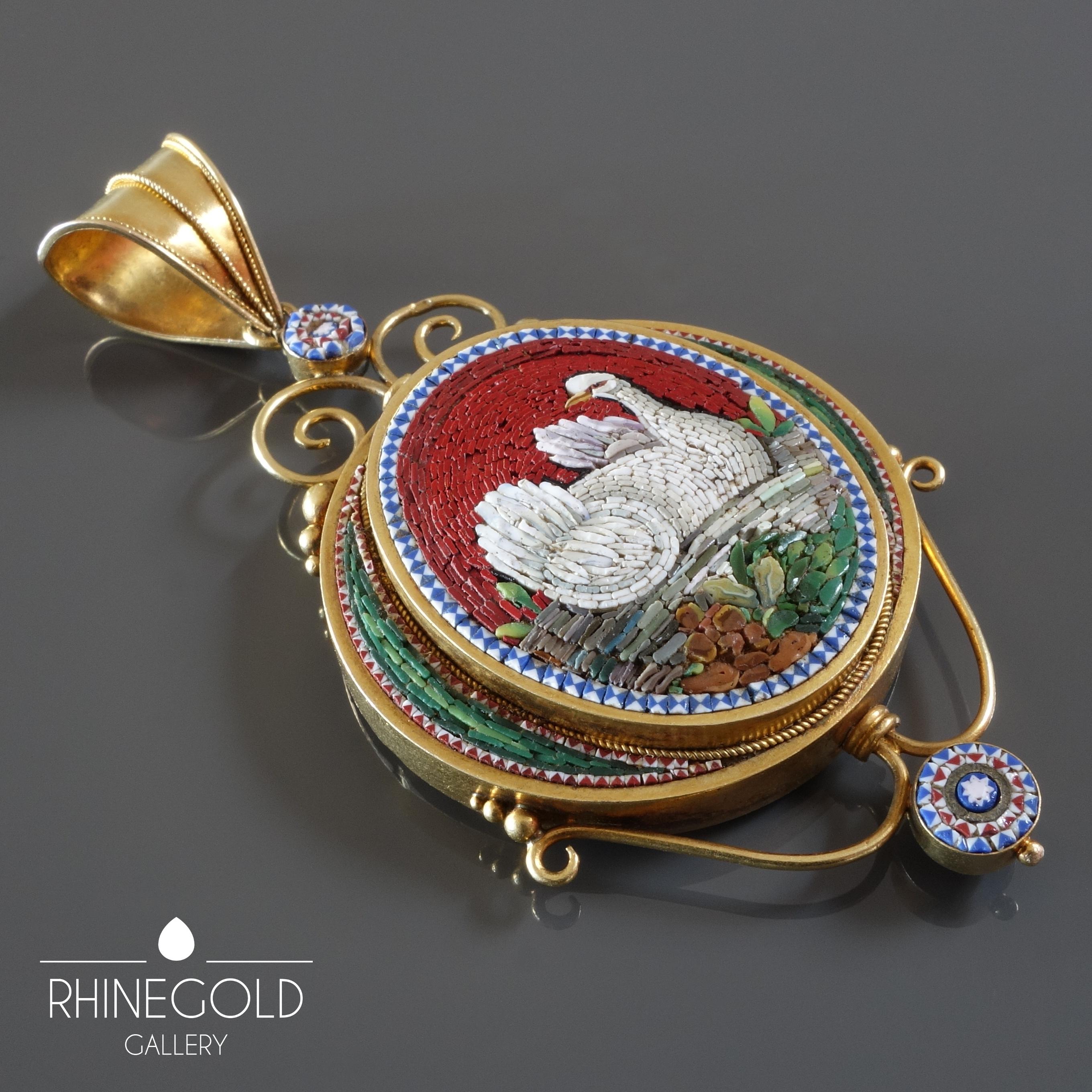1870s Antique Grand Tour Italian Micromosaic Swan Gold Locket Pendant
18K yellow gold, glass tesserae, weight approx. 22.5 grams
L 7.6 cm (approx. 3“), W 3.8 cm (approx. 1 1/2“)
Marks: illegible; tested for 18k gold
Italy, 1870s

An antique Italian