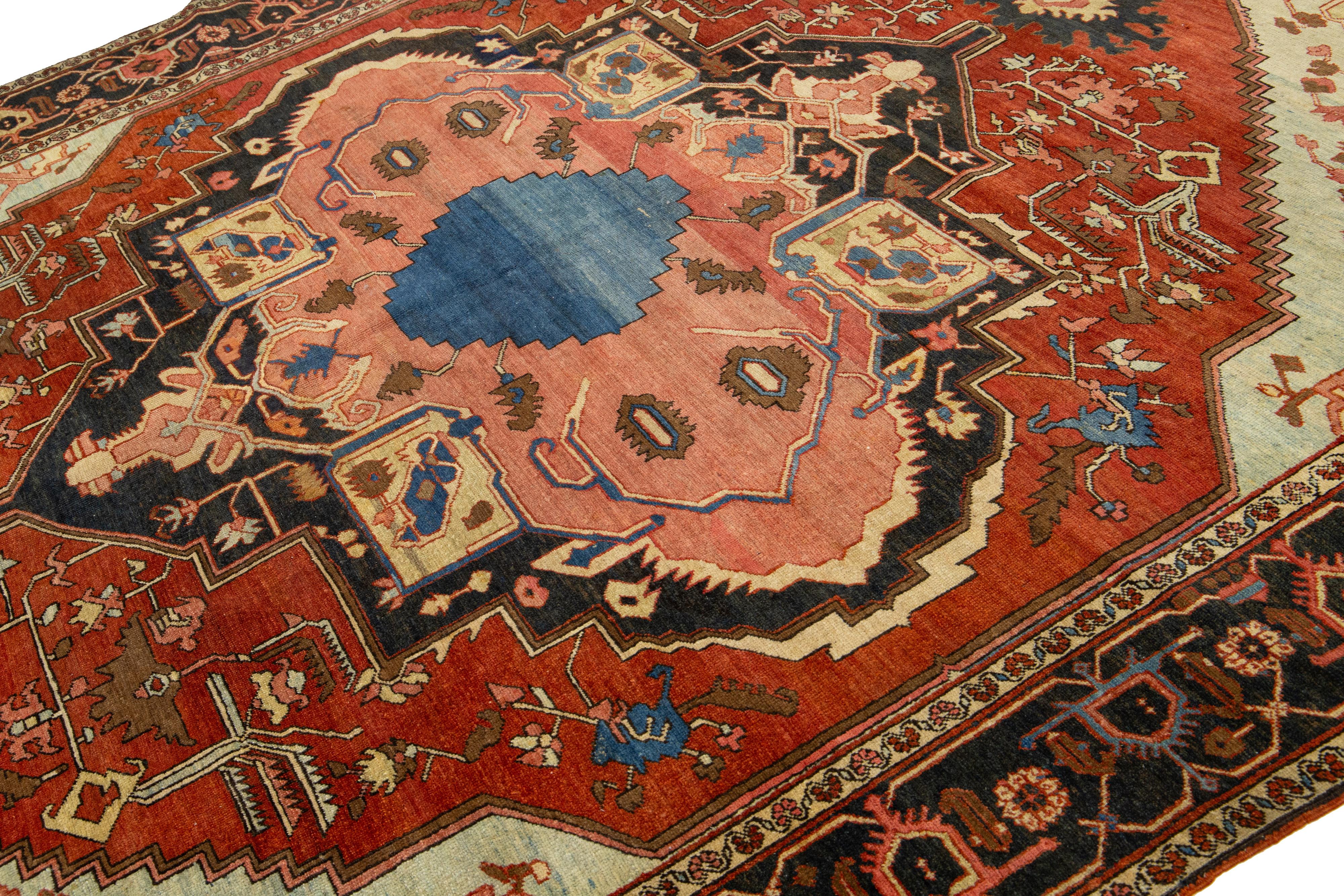 Hand-Knotted 1870s Antique Wool Rug Persian Serapi Featuring a Medallion Motif In Rust Color For Sale