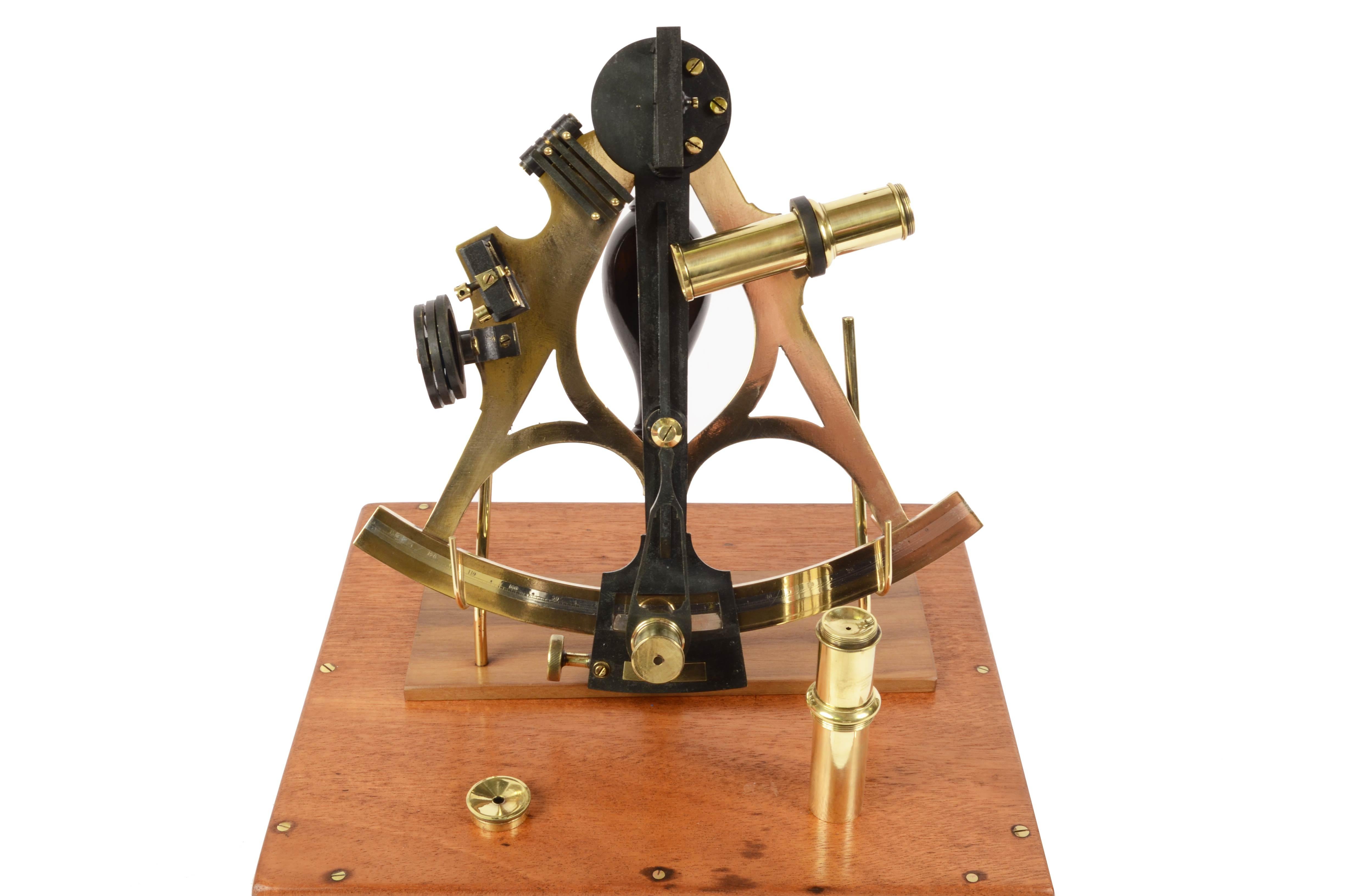 Brass sextant signed Ainsley South Shields (1858-1886) complete with original wood case and lenses. 
Silver vernier, wood handle, 3 colored glasses for the fixed mirror and 4 for the mobile one, two telescopes, a microscope for reading the vernier,