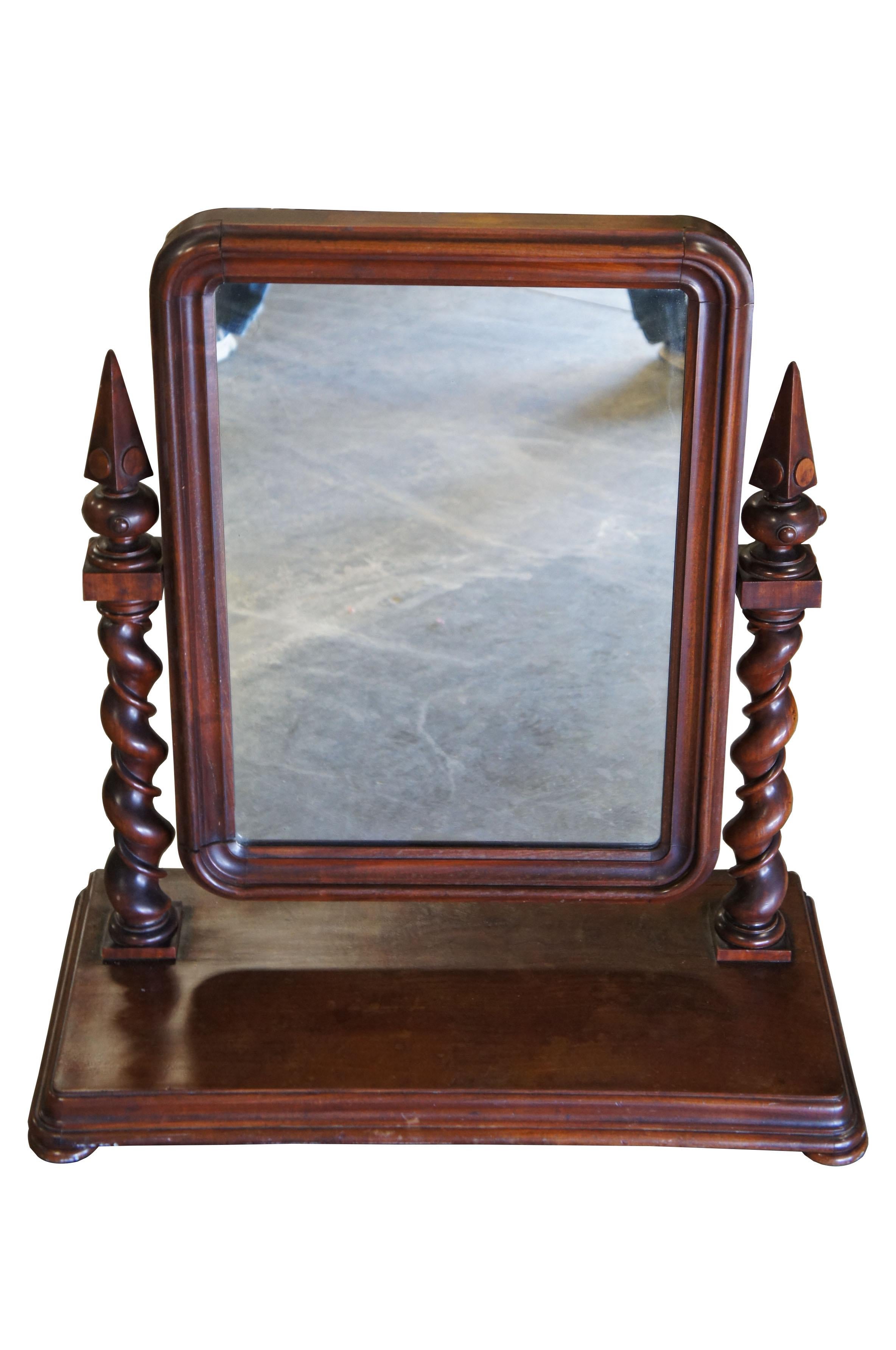 1870s English Empire mahogany gentleman’s dressing shaving mirror barley twist

English Empire gentleman's dressing mirror, circa 1880s. Made from mahogany with a beveled wooden frame supported by exceptional barley twist uprights with pyramid