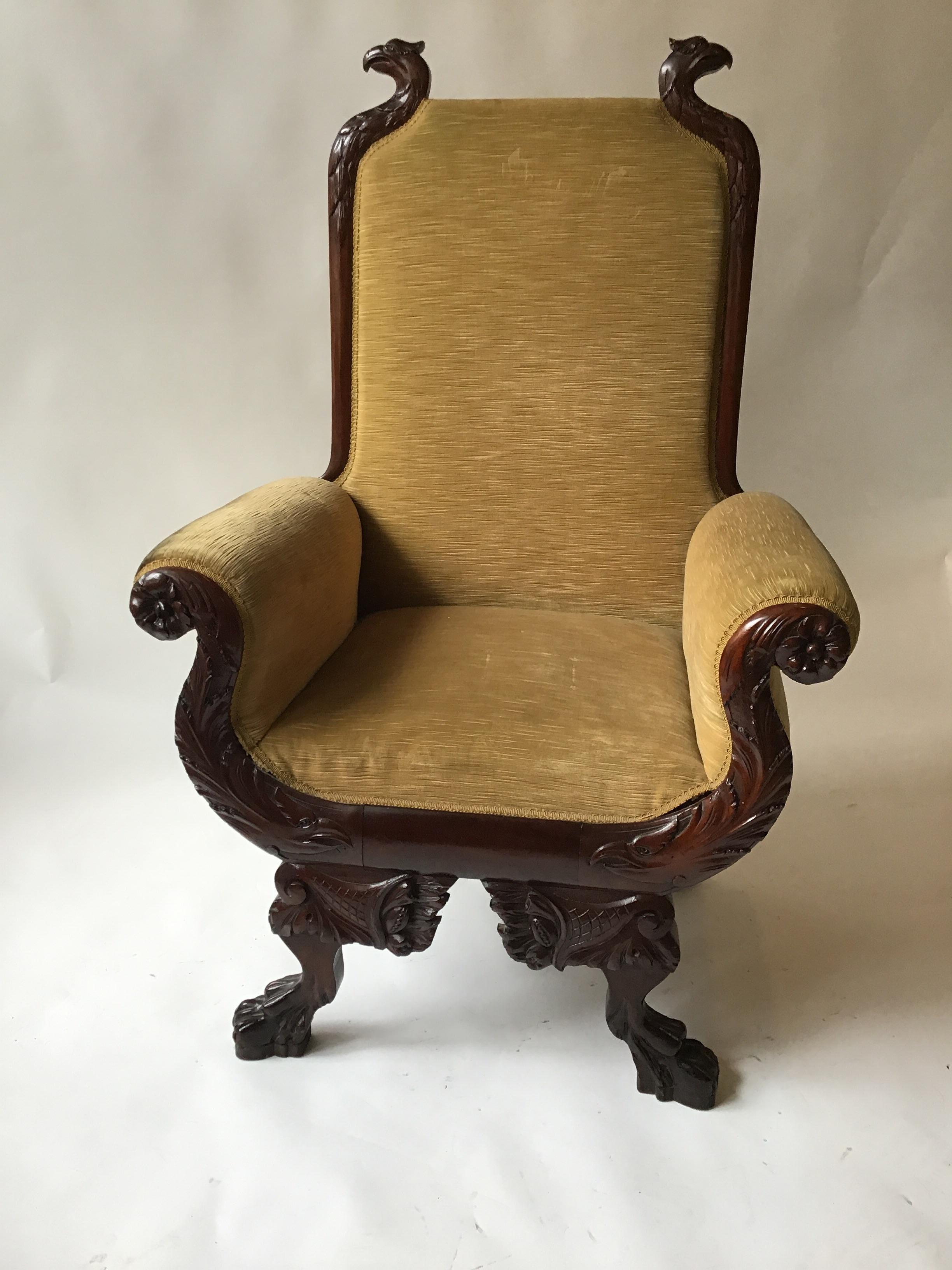 1870s federal carved wood eagle throne chair from the Jay Gould estate. This oversized chair is wonderful, carved eagles adorn the top and base of the chair. Great big lion paw feet.