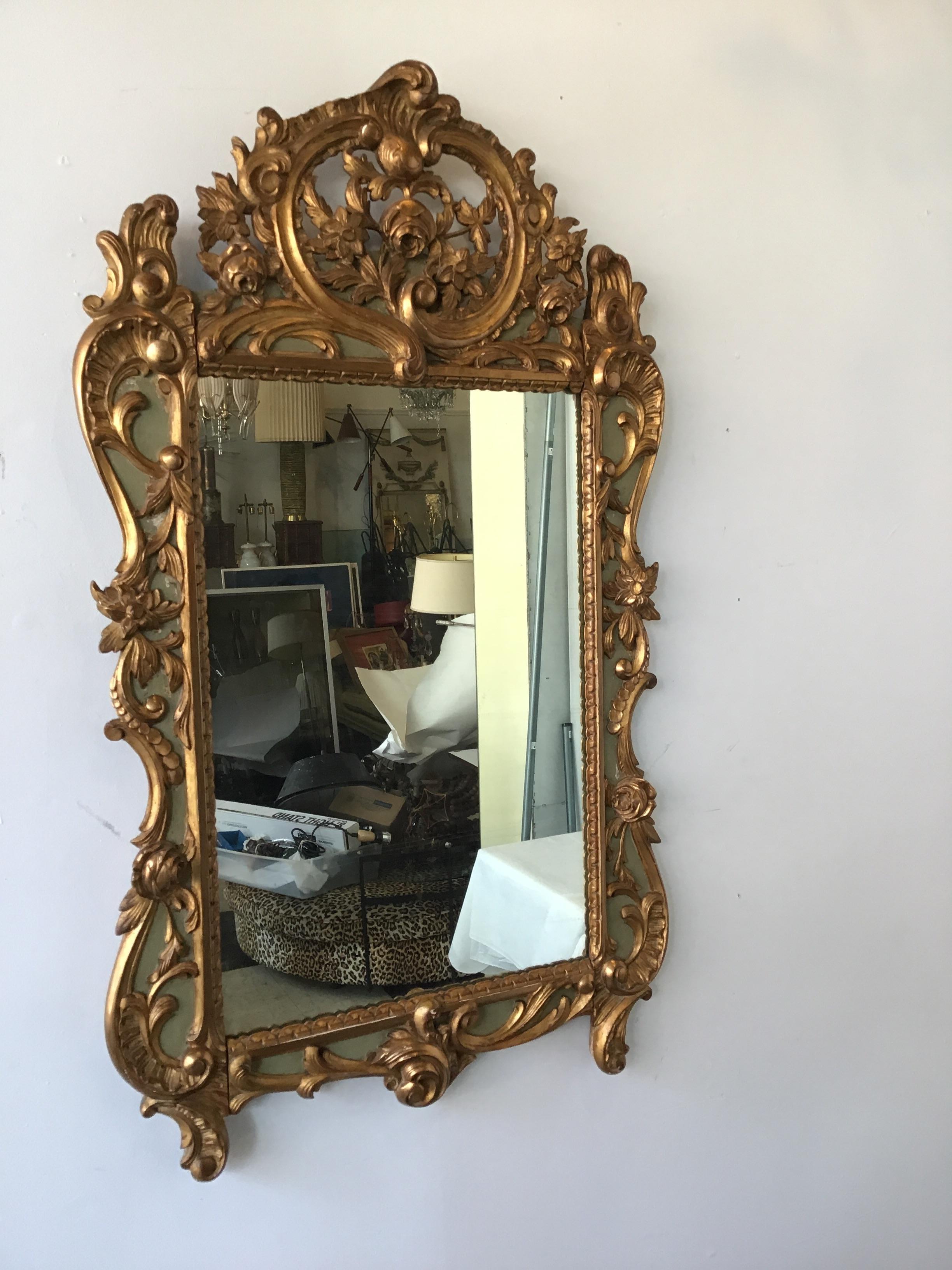 1870s French carved wood gilt mirror.