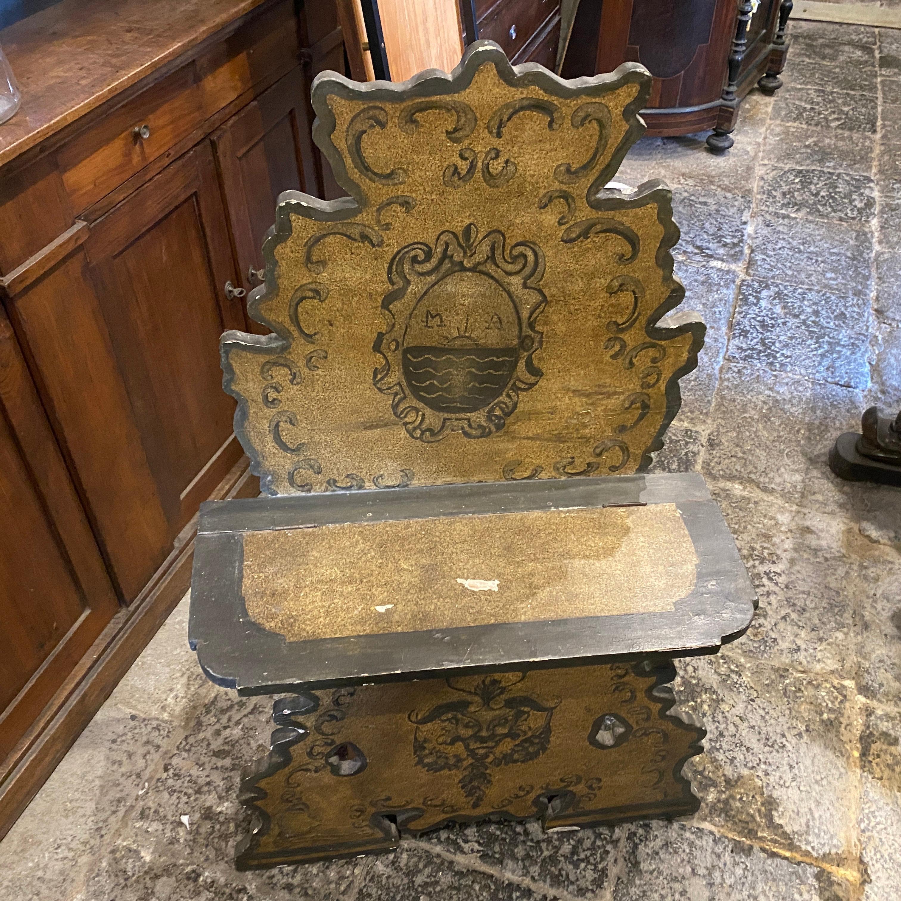 A rare bench made in Italy in late 19th century, it's decorated on green tones with a noble coat of arms. It's in good conditions considering the age.