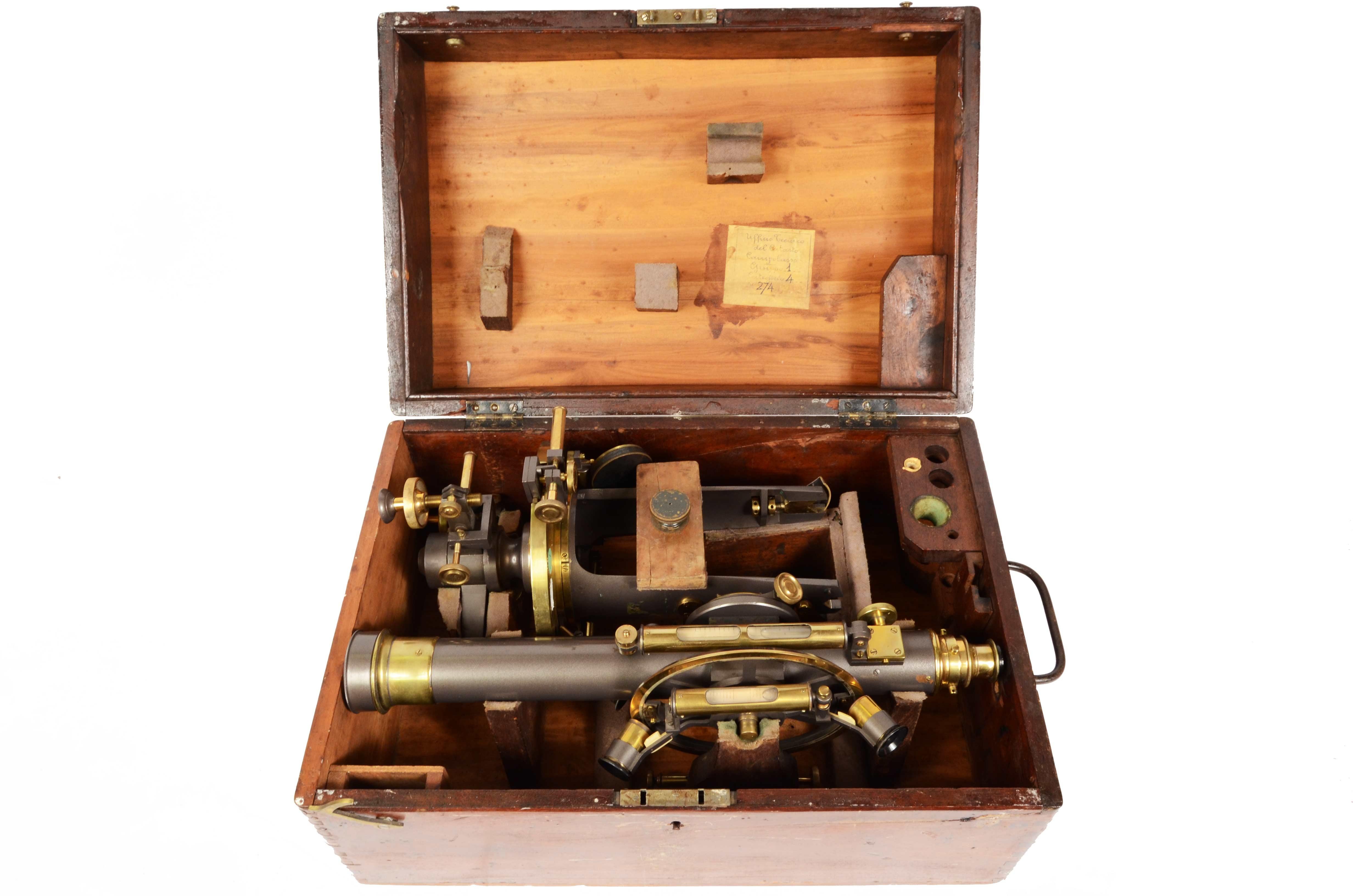 Burnished brass theodolite with long telescope complete with original walnut case, Italian manufacture from the second half of the 19th century. A label placed inside the cash box informs that this tool was used by the Campobasso cadastre. This