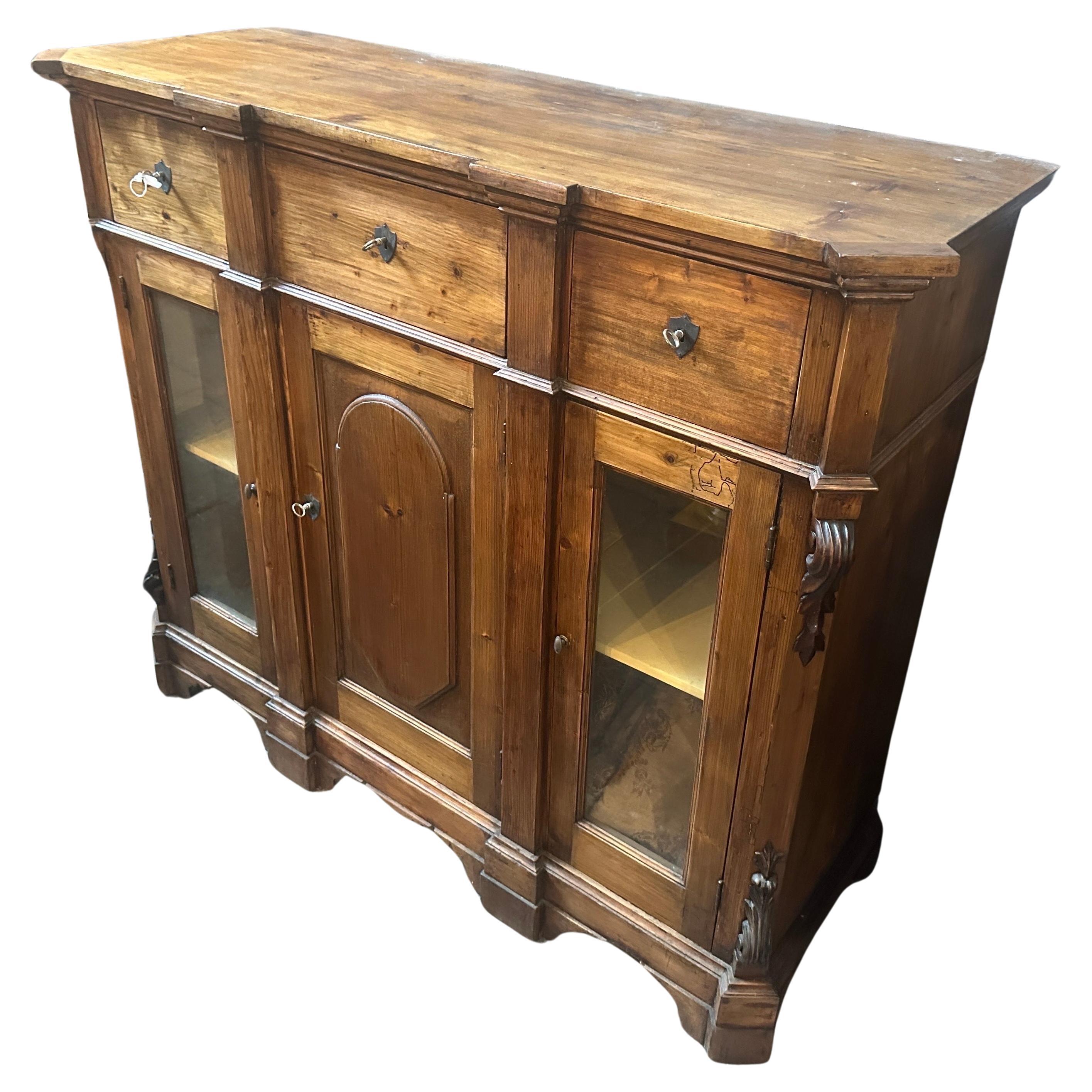 This Sicilian Credenza is a splendid piece of antique furniture that encapsulates the elegance and craftsmanship of the era. Crafted during the reign of Louis Philippe, this credenza it's in original condition, with signs of use and age visible on