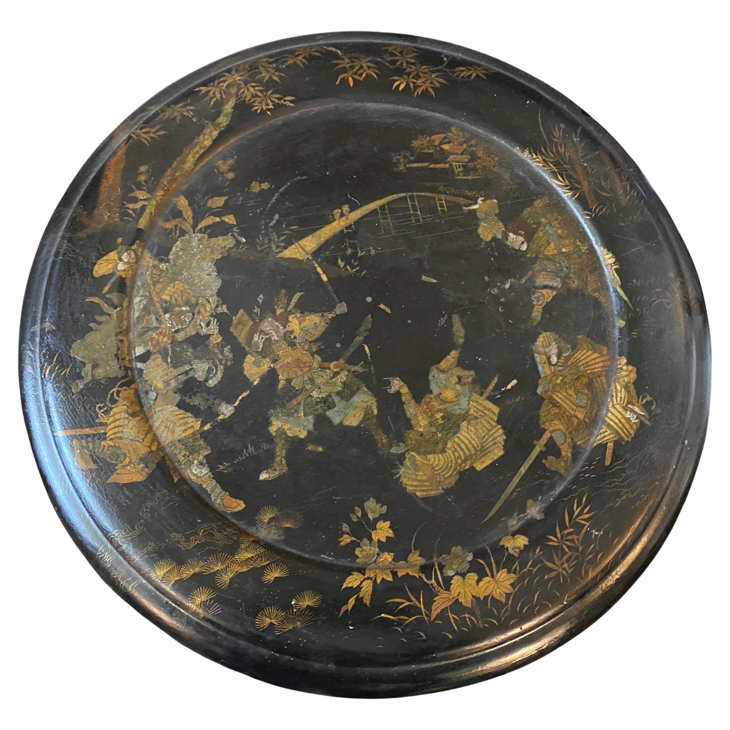 An amazing paper maché tilt top table manufactured in England in late 19th century, the ebonized wood part holds the papier mach top decorated with orientalist figures.
