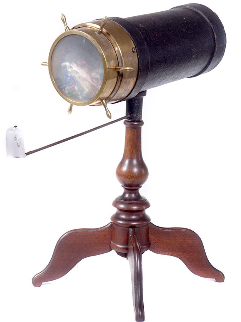 This kaleidoscope is in beautiful original condition. This example is also signed on the wood base. The four leg example is the configuration collectors look for. Most noteworthy about the bush kaleidoscopes were the glass pieces contained in the