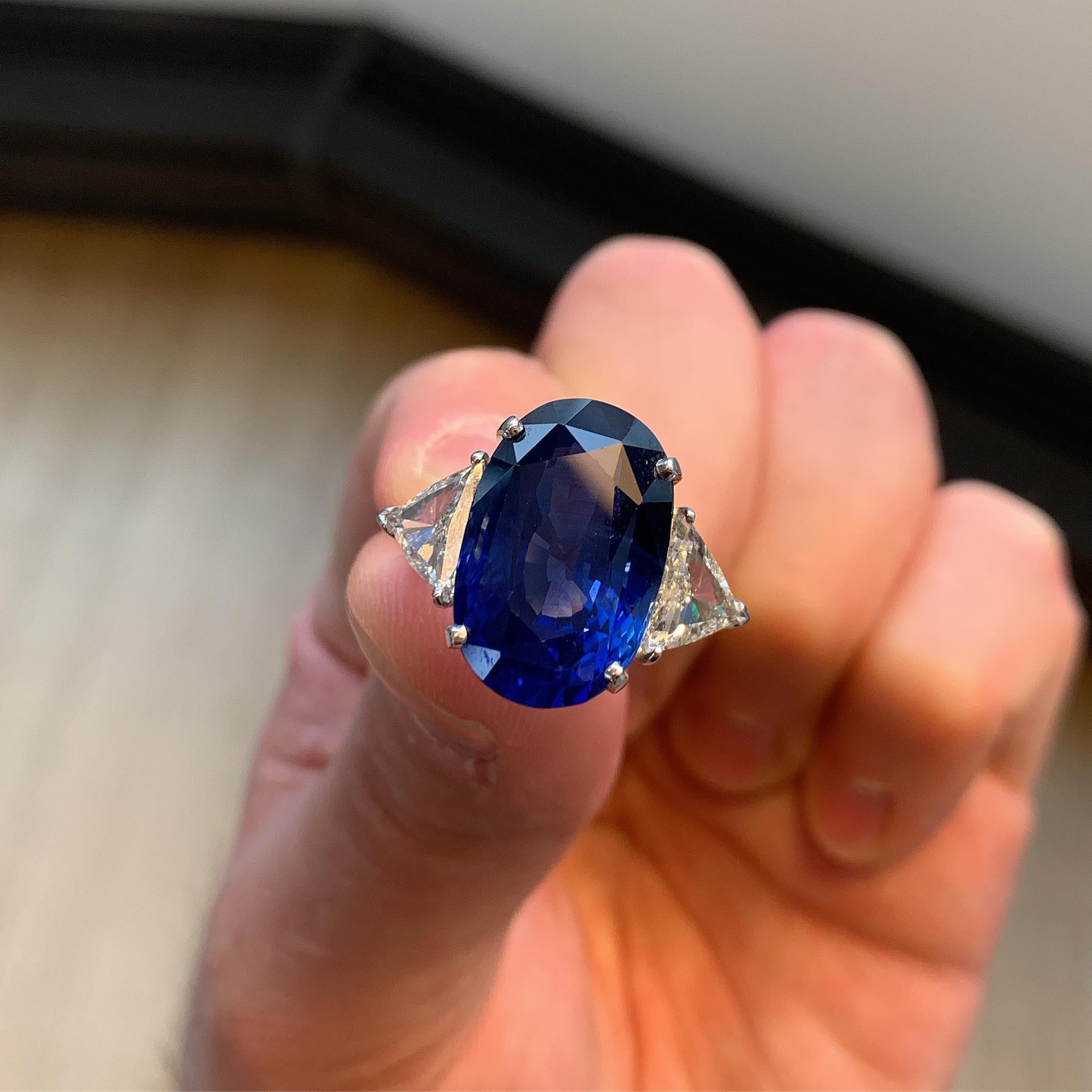 18.75 ct Oval Sapphire and Diamond Ring

Two triangular diamonds weigh 1.65 cts