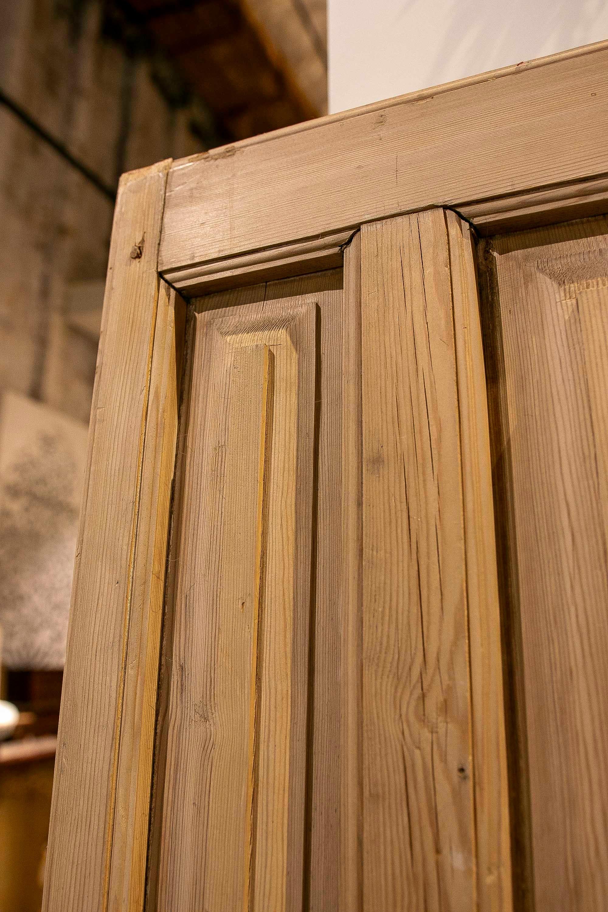 Spanish 1875s Pair of Antique Wooden Doors with Carved Panels and Iron Knocker For Sale