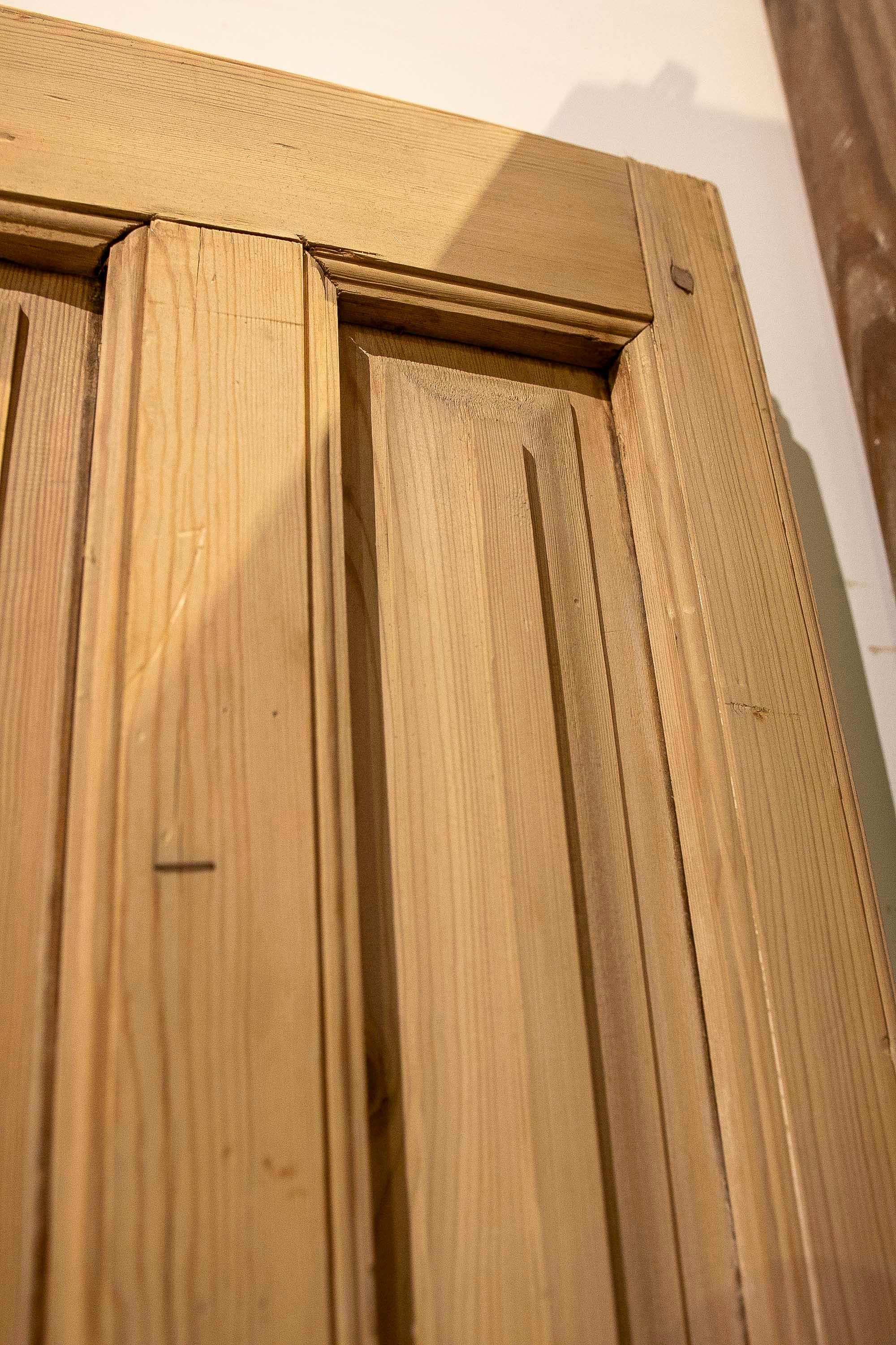 1875s Pair of Antique Wooden Doors with Carved Panels and Iron Knocker For Sale 4