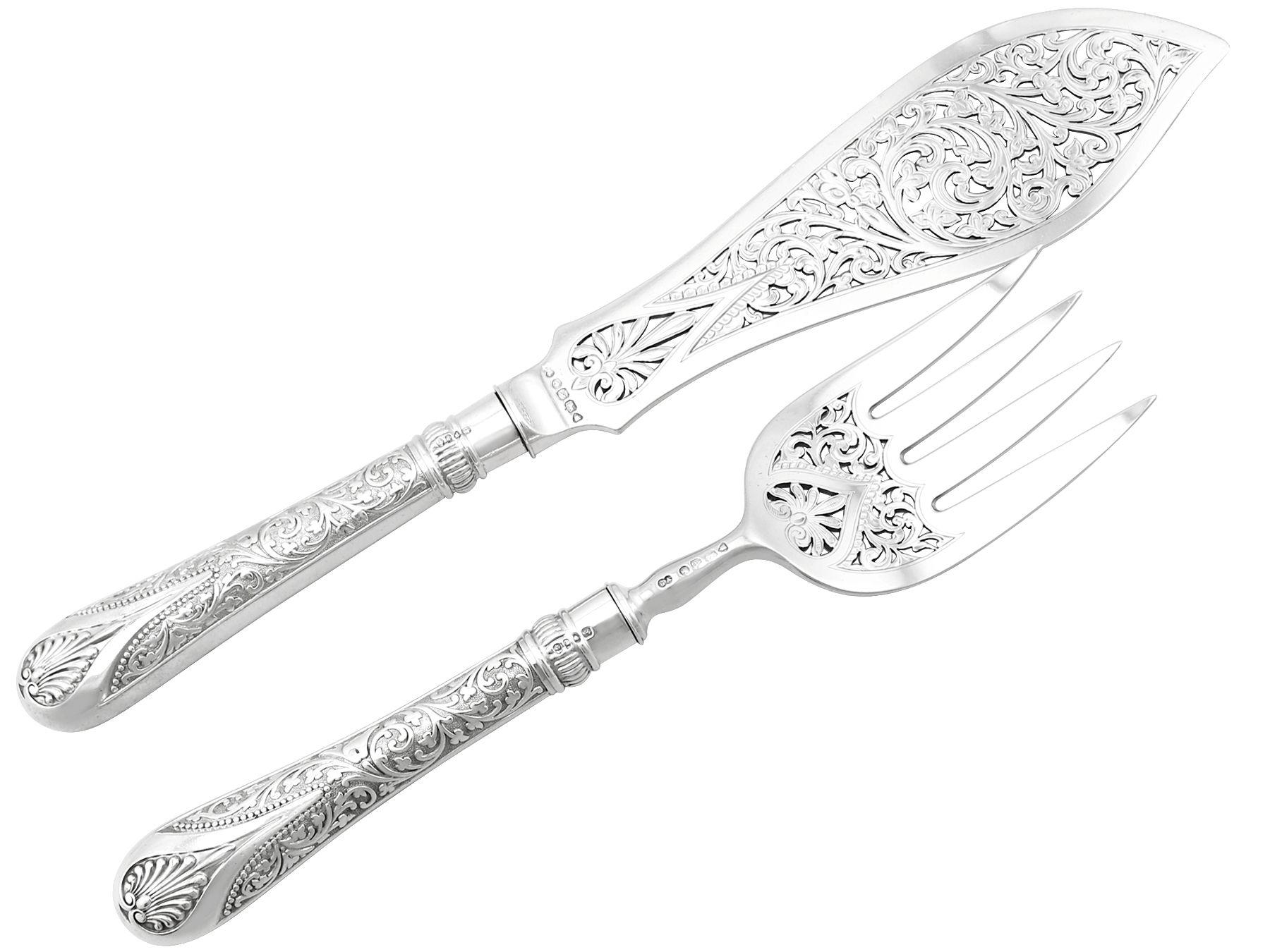 An exceptional, fine and impressive pair of antique Victorian English sterling silver Newton pattern fish servers - boxed; an addition to our silver flatware collection.

This exceptional pair of antique Victorian sterling silver fish servers