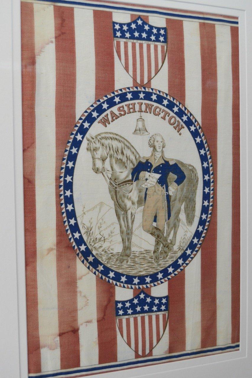 This is a Centennial banner featuring a depiction of George Washington and his horse, circa 1876. This unique patriotic banner was made and used during the American Centennial celebrations, which were held in Philadelphia, Pennsylvania in 1876. The