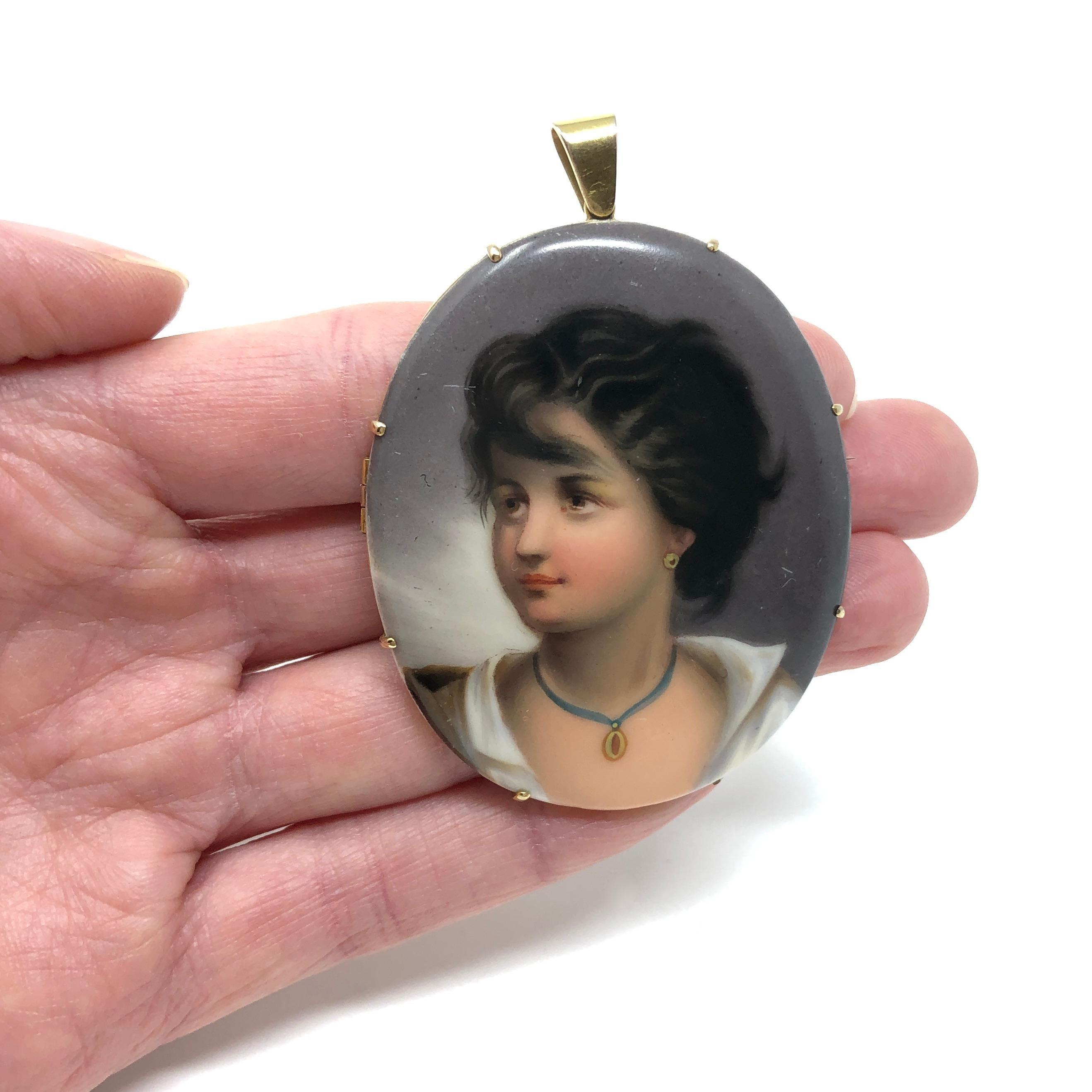 This wonderful example of Victorian jewellery was created in 1876. It can be worn as a pendant or a brooch.

Condition Report:
Excellent

The Details...
Constructed from 9ct gold, this pendant features an oval porcelain plaque hand-painted with a