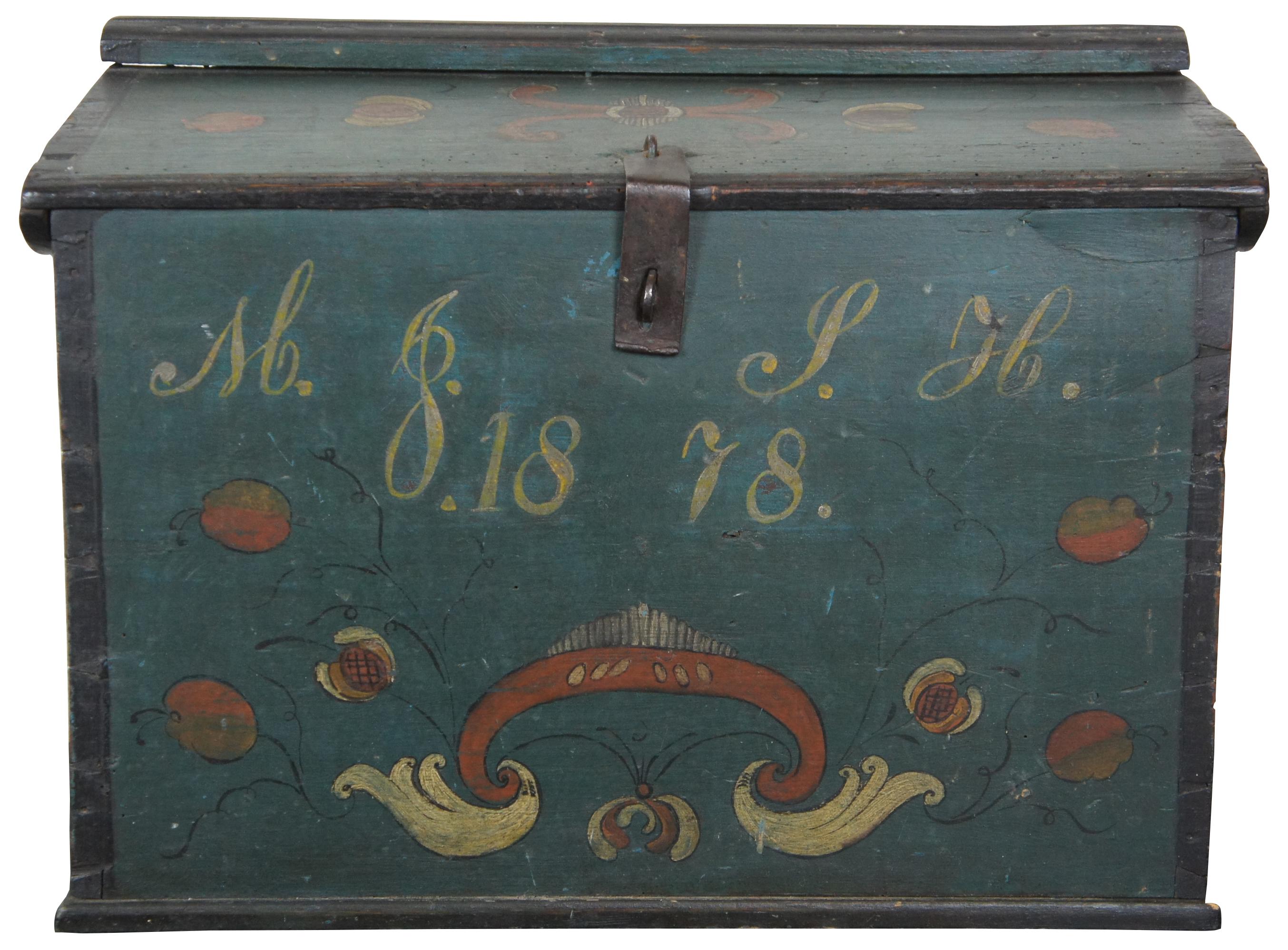 Antique pine box with clasp for a padlock, painted in green and black with folk art style fruit designs and two sets of initials over the date 1878
