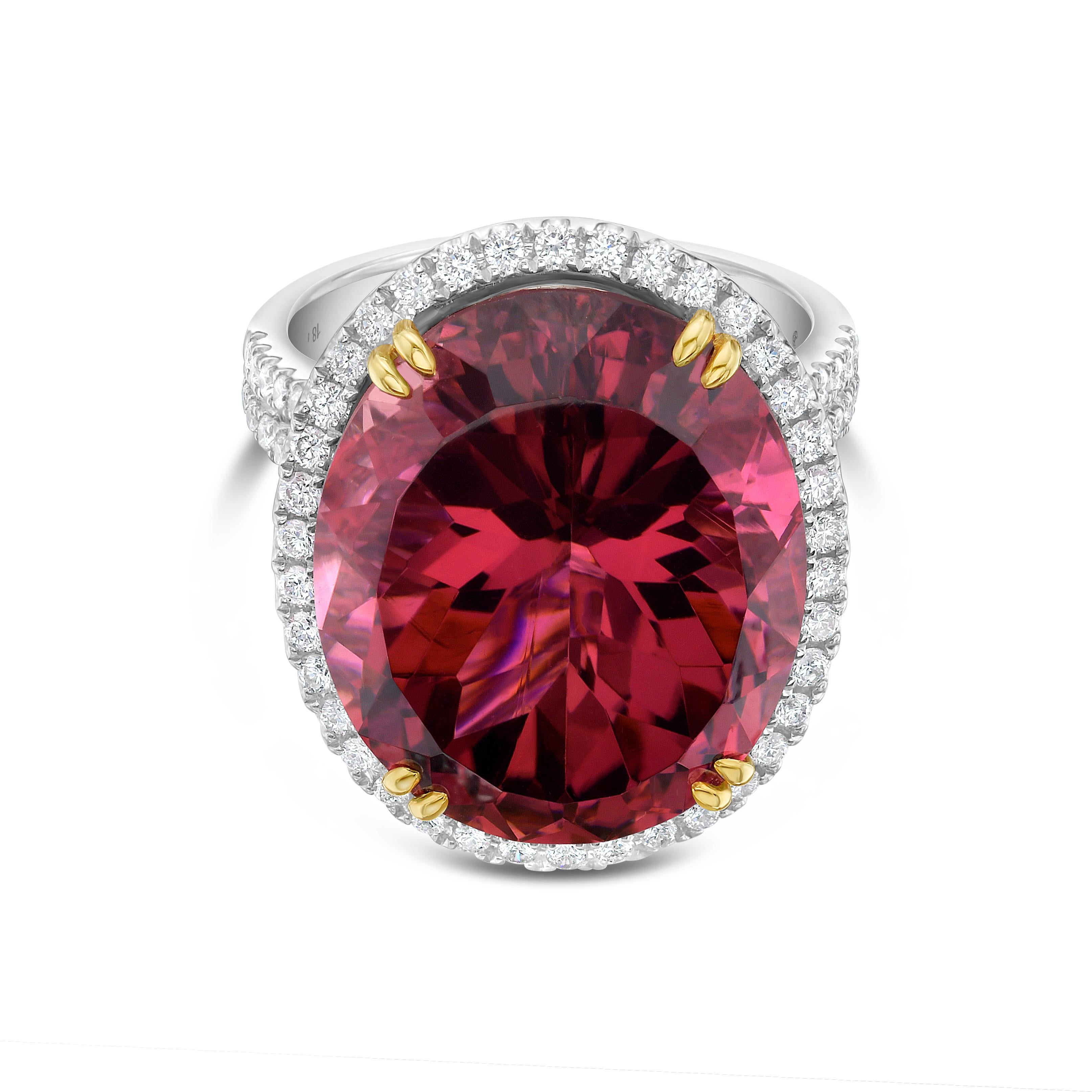 This stunning cocktail ring showcases a beautiful 18.79 Carat Oval Rubellite Tourmaline with a Diamond Halo on a Double Diamond Shank. This ring is set in 18k White Gold, with 18k yellow gold prongs on the center stone.
Total Diamond Weight = 0.83