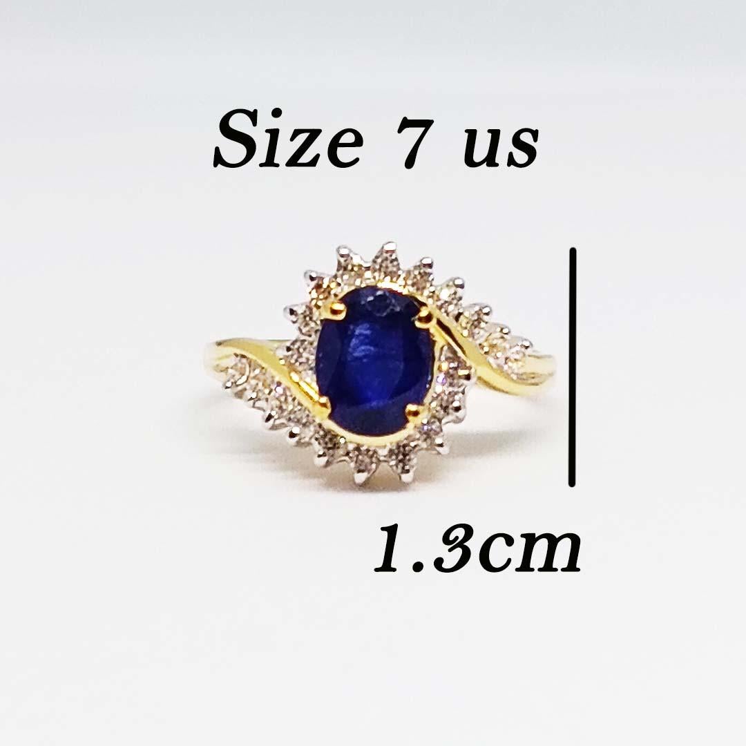 Blue Sapphire(Dark color) Oval 1.87 cts. size 8x6 mm.
White Zircon round 1.5 mm. 18 pcs.
Sterling silver on 18K Gold Plated.
Size ring 7 us.
