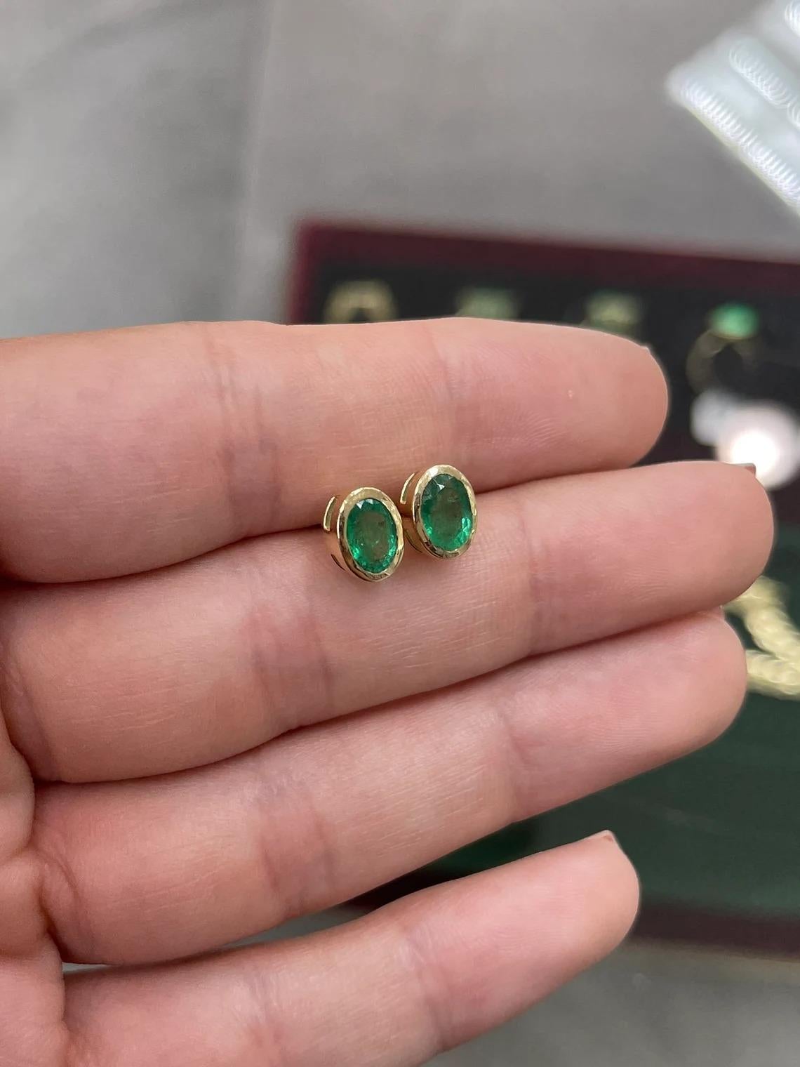 Modern 1.87tcw 14K Natural Emerald-Oval Cut Bezel Set Yellow Gold Stud Earrings For Sale