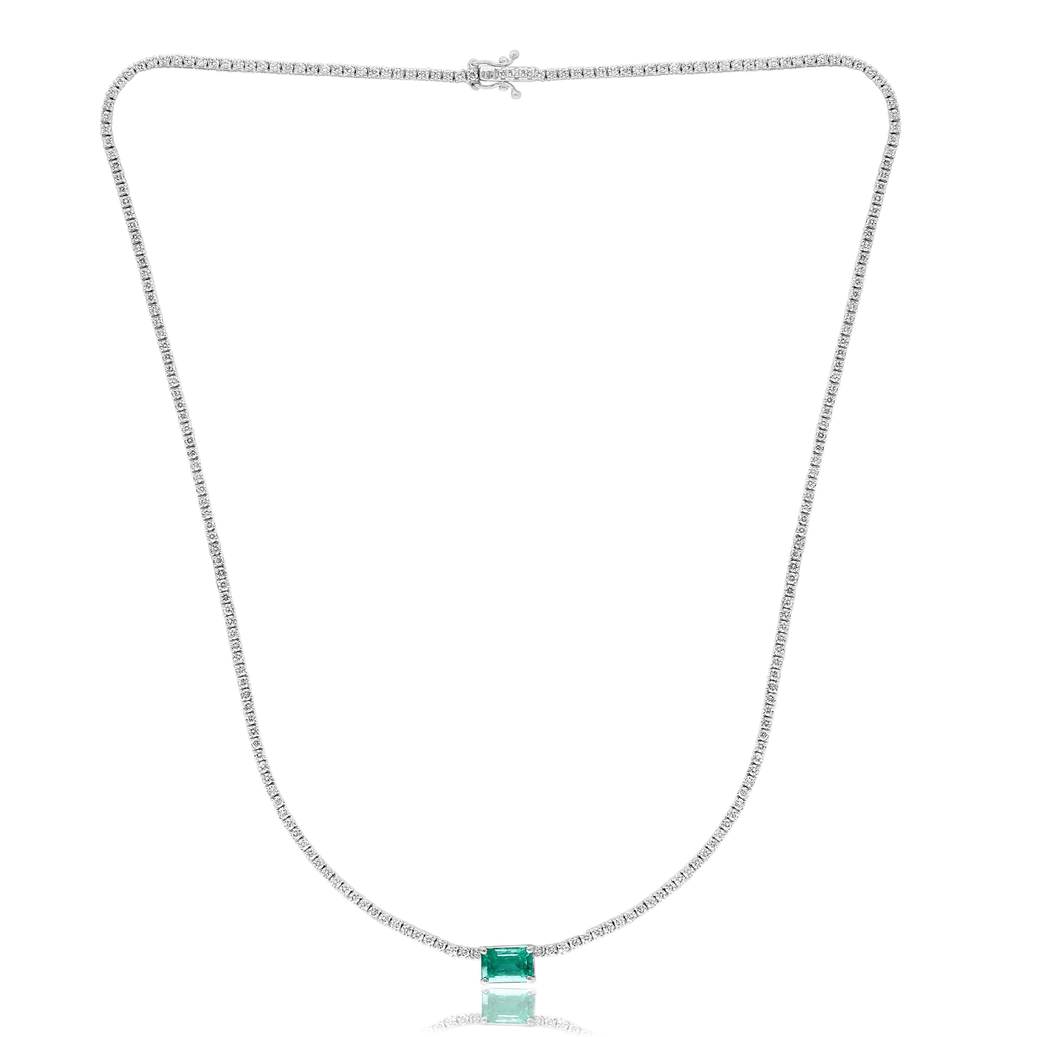 A brilliant and classic piece showcasing emerald-cut vivacious green emerald in the center weighing 1.88 carats and a line of round diamonds on both sides set in 14K White Gold. 239 diamonds in this necklace are brilliant round cut and weigh 3.01