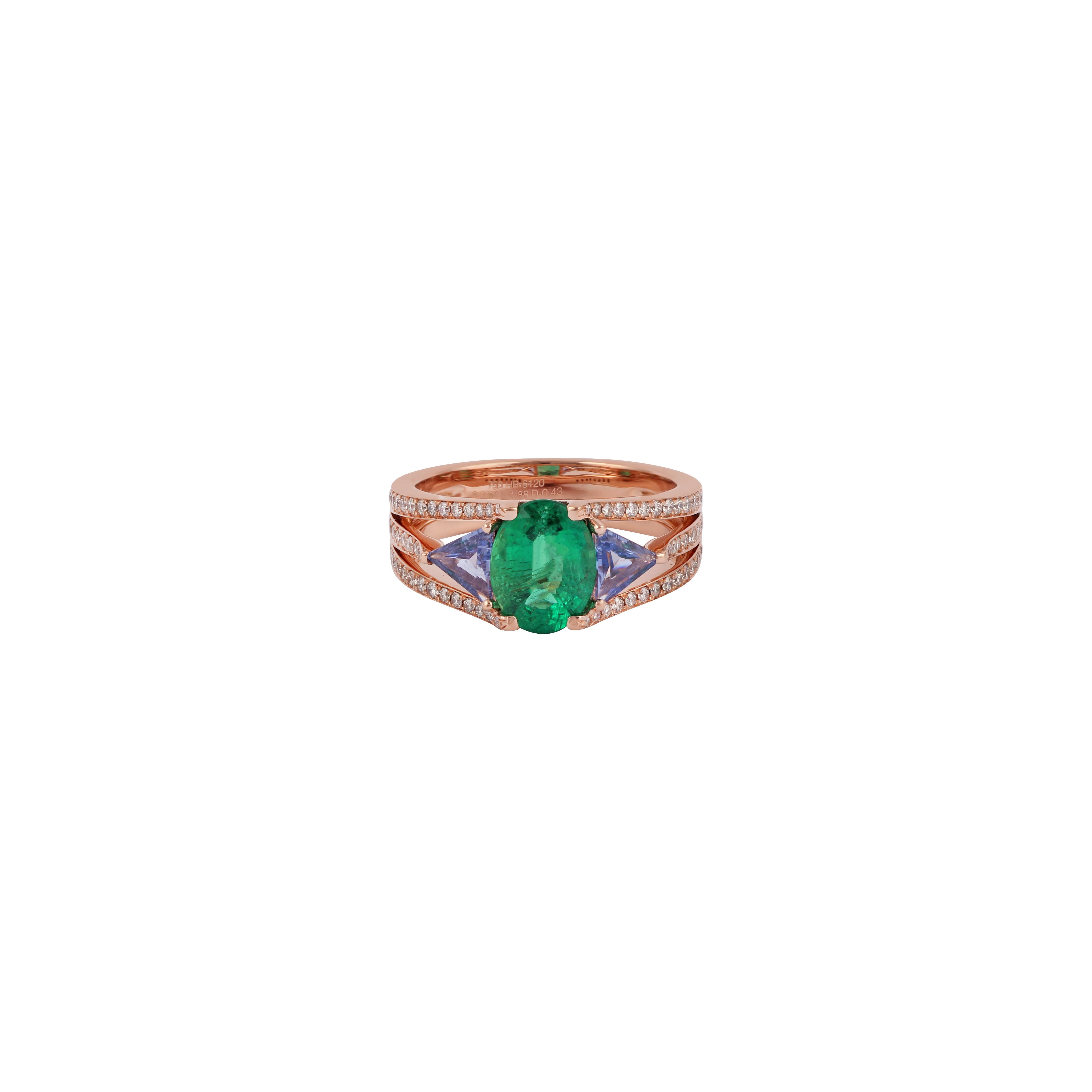 Its an elegant ring studded in 18k rose gold with 1 oval shaped fine quality emerald weight 1.88 carat with both sides 2 trilliant shaped sapphire weight 0.64 carat & 74 round shaped diamond weight 0.43 carat, this entire ring studded in 18k rose