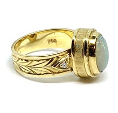 Anillo de oro amarillo de 18 quilates con diamantes y ópalo de 1,88 quilates
