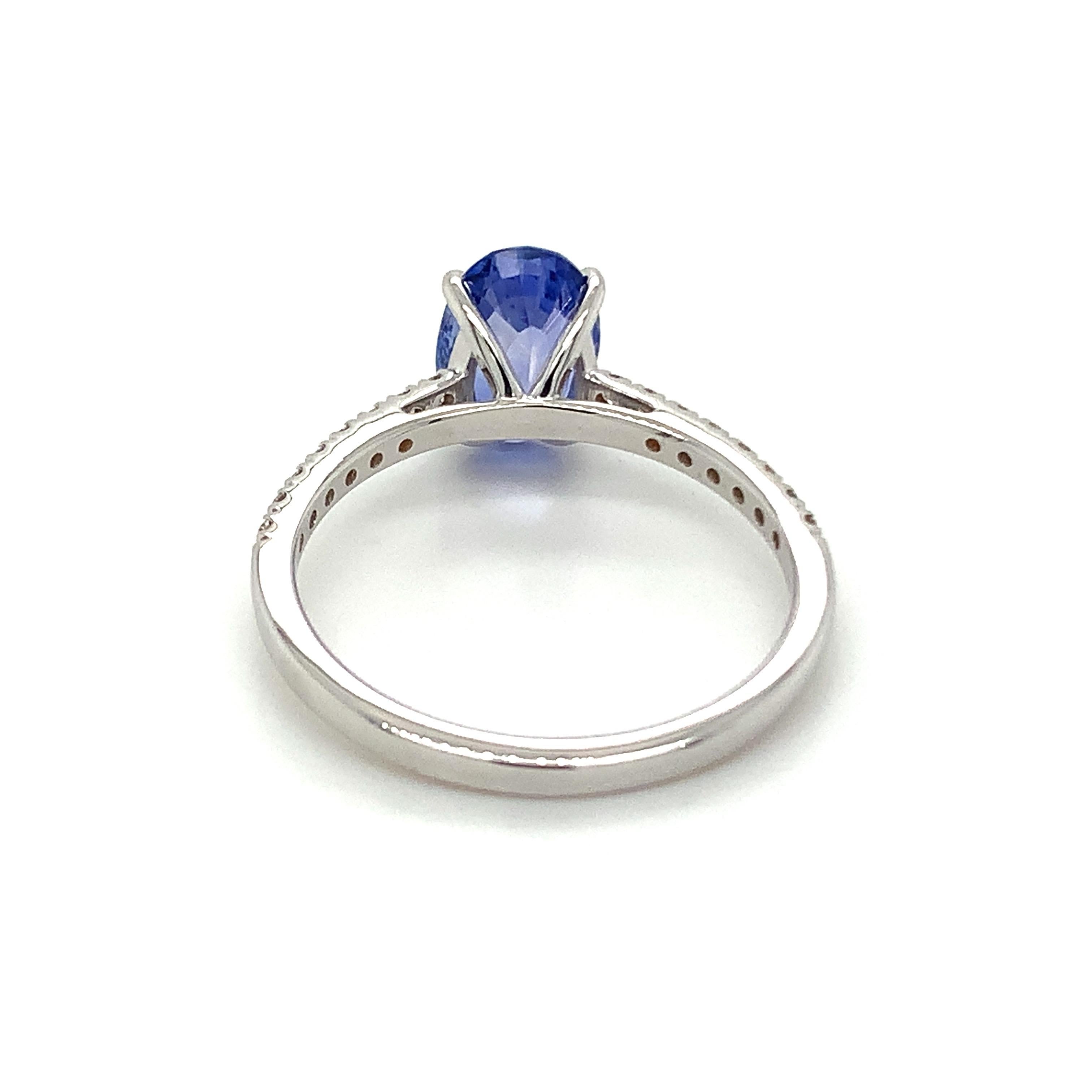 Modern 1.88 Carat Oval Shape Blue Sapphire Ring with Diamonds in 10k White Gold For Sale