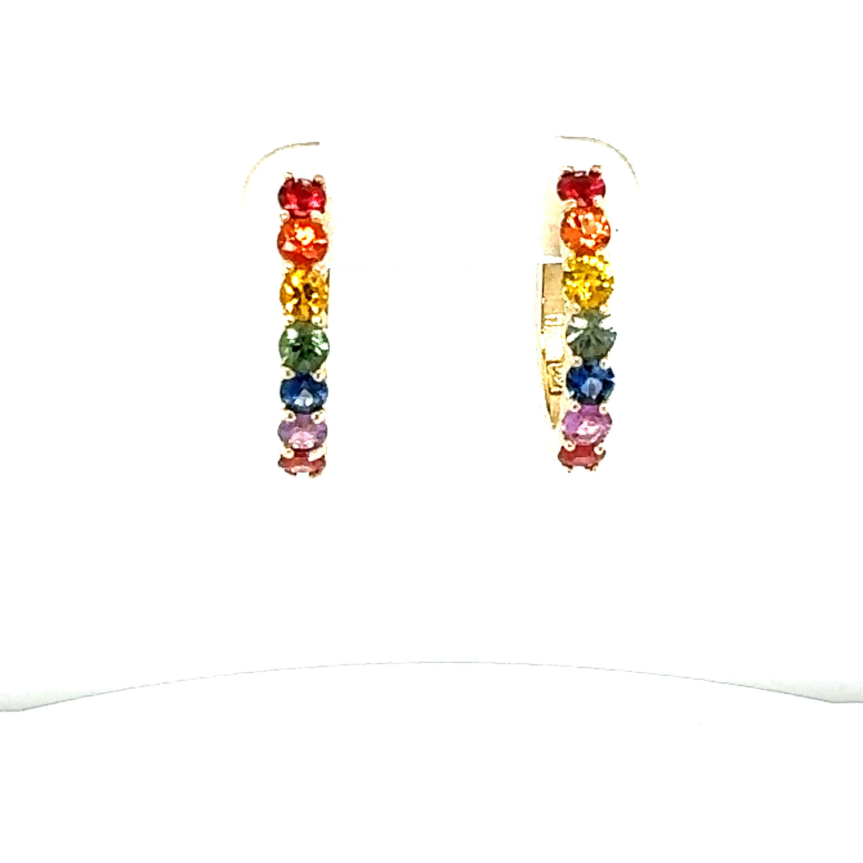 1.88 Carat Rainbow Sapphire Yellow Gold Hoop Earrings
Beautiful Everyday Huggy Earrings 

Item Specs:

14 Round Cut Multi-Colored Natural Sapphires weighing 1.88 carats
Crafted in 14K Yellow Gold approximately 4.3 grams
Length of Earrings is 0.75