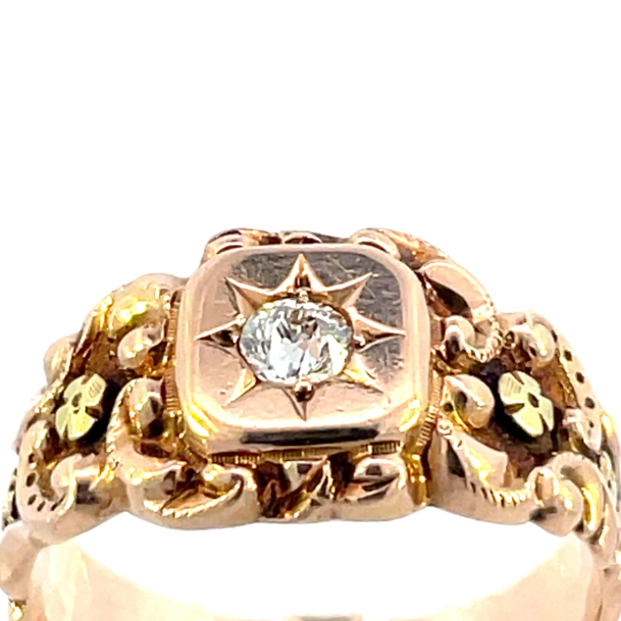 A magnificent 1880 14K Rose Gold Victorian Ring & Applied Green Gold Florets with a Beautifully Cut European Diamond that is unlike any other. The center of the ring features a vs2 in clarity H color European Cut diamond. It is a true representation