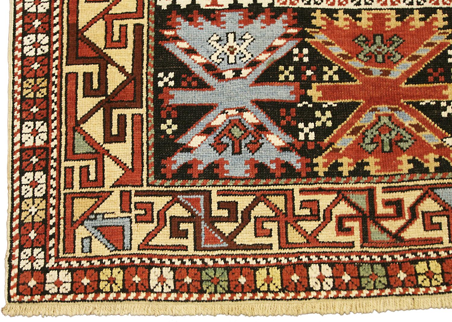 This is an antique Shirvan rug from the southern part of the Caucasus mountains and it was woven during the end of the 19th century. The field of this rug is decorated with repeating hooked medallions and its yellow and black borders create color