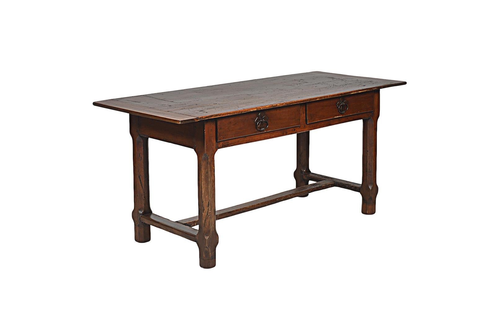 This is an old french table that can be used as dining table or as a writing, desk table.
The patina on the walnut is beautiful, some repairs have been made as the picture show a part of the top was a long time ago replaced as well as the bottom