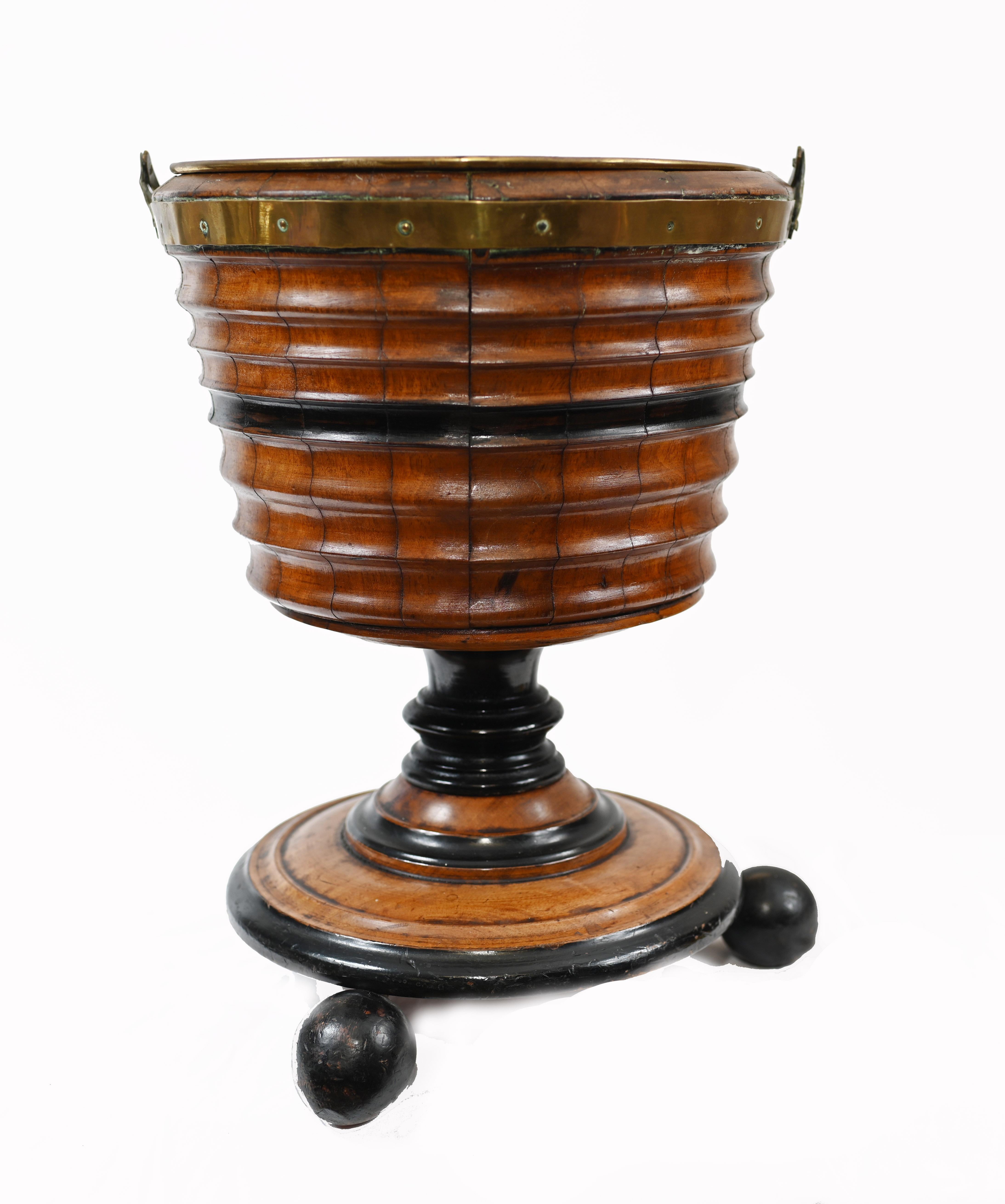 These buckets were originally used as braziers for holding charcoal and a tea-kettle
Crafted from moulded staves of ebony, walnut and holly and has original brass liner
We date this to circa 1880
Make for a great decorative piece or as a