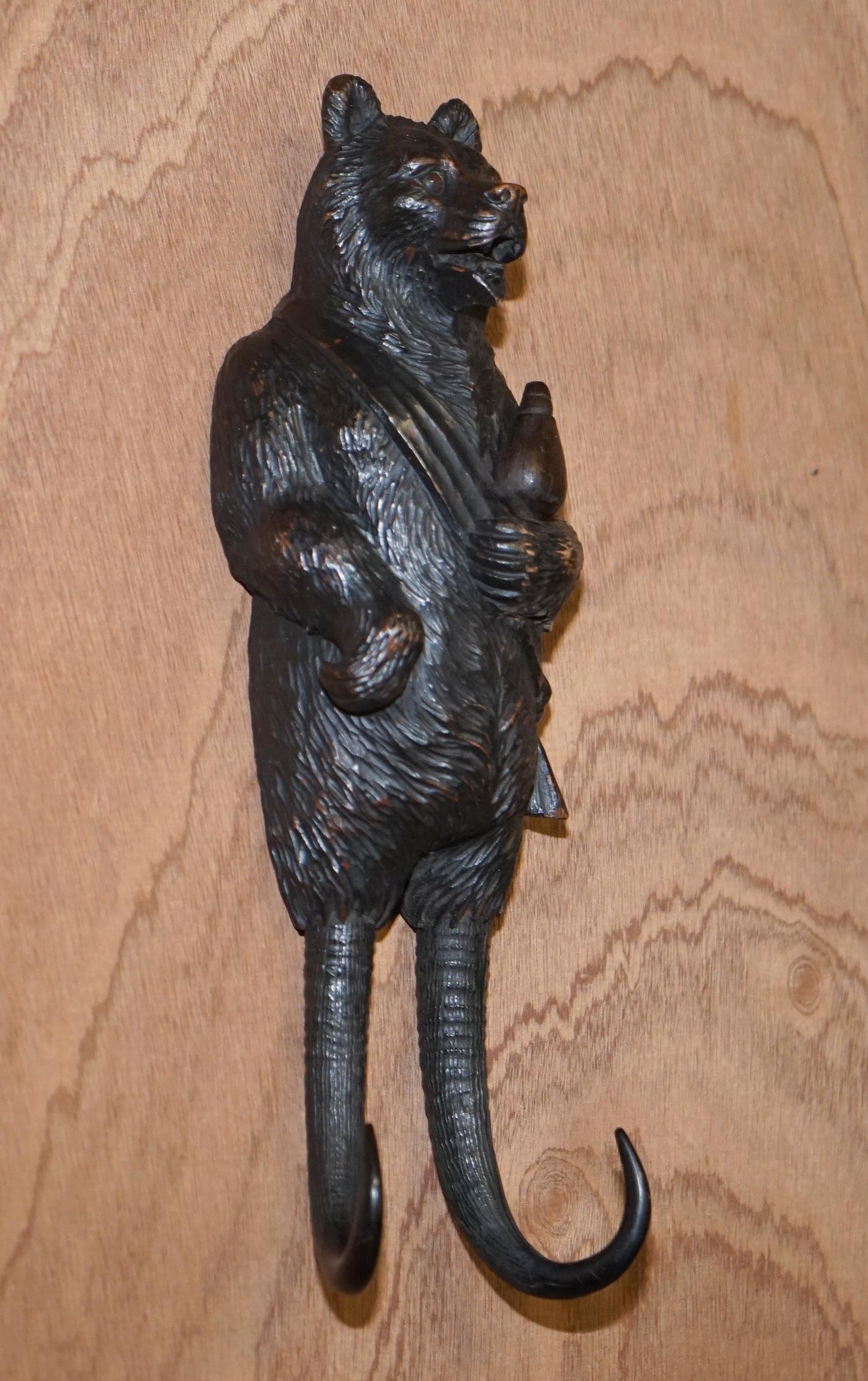 We are delighted to offer for sale this stunning original circa 1880 Swiss made Black Forest wood, whip hook of a Bear with a flask of beer

A very very rare find, this is a medium to large whip hook, they come in varying sizes and this is a good