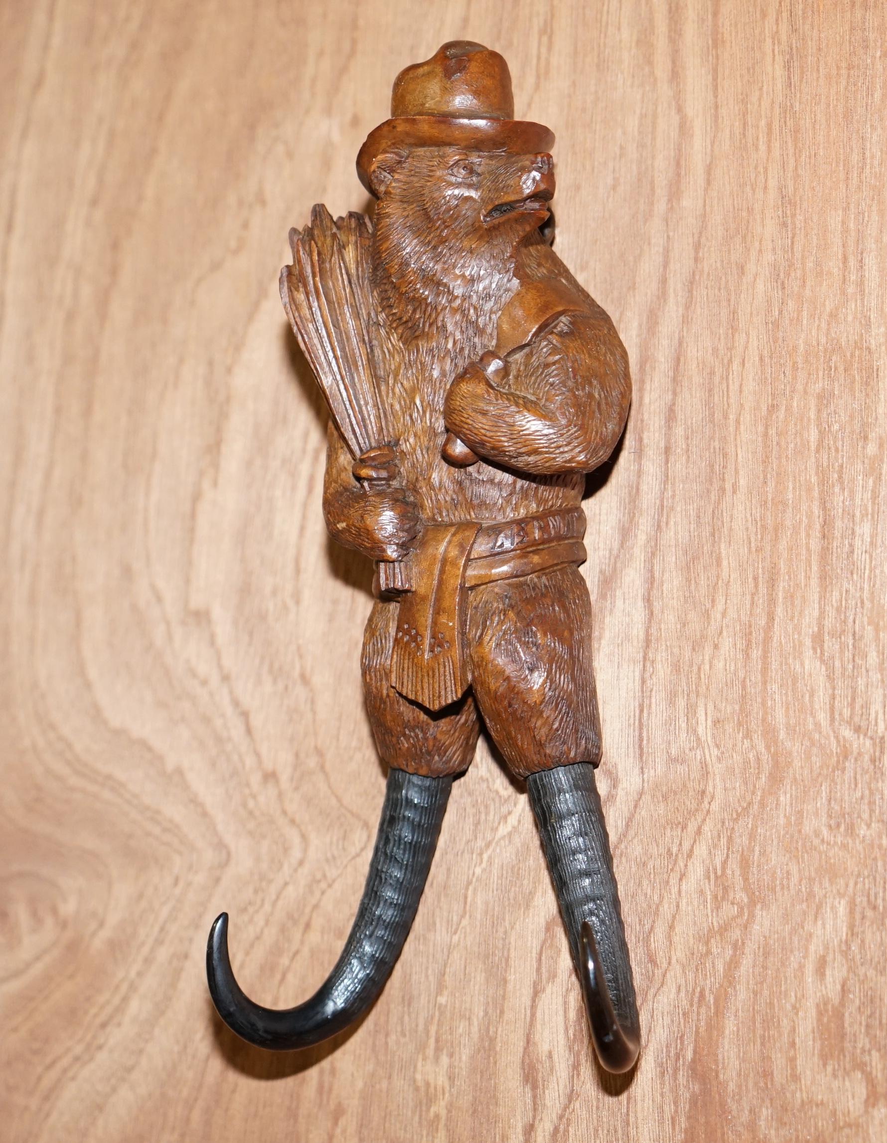 We are delighted to offer this stunning original circa 1880 Swiss made Black Forest wood, whip hook of a Bear with hat holding fresh cut corn.

A very very rare find, this is a medium whip hook, they come in varying sizes and this is a good size.