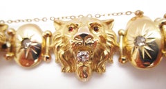 1880 Victorian 14 Karat Yellow Gold Diamond and Red Garnet Lion Bracelet