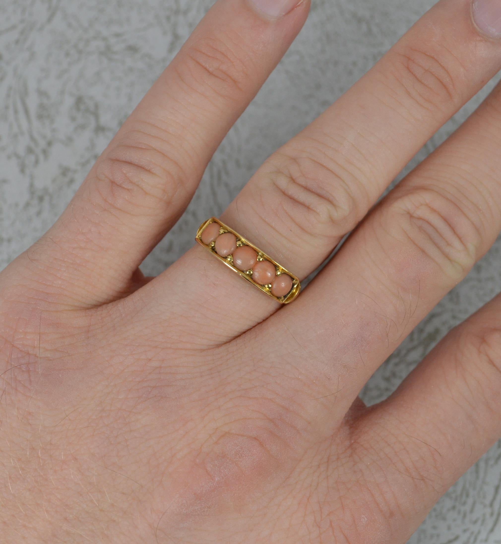 A superb Victorian period ring.
Solid 18 carat yellow gold example.
Set with five round shaped coral stones.
17mm spread of stones, 5.2mm wide band to front.

CONDITION ; Good for age. Clean and solid band. Securely set stones. Light wear only.