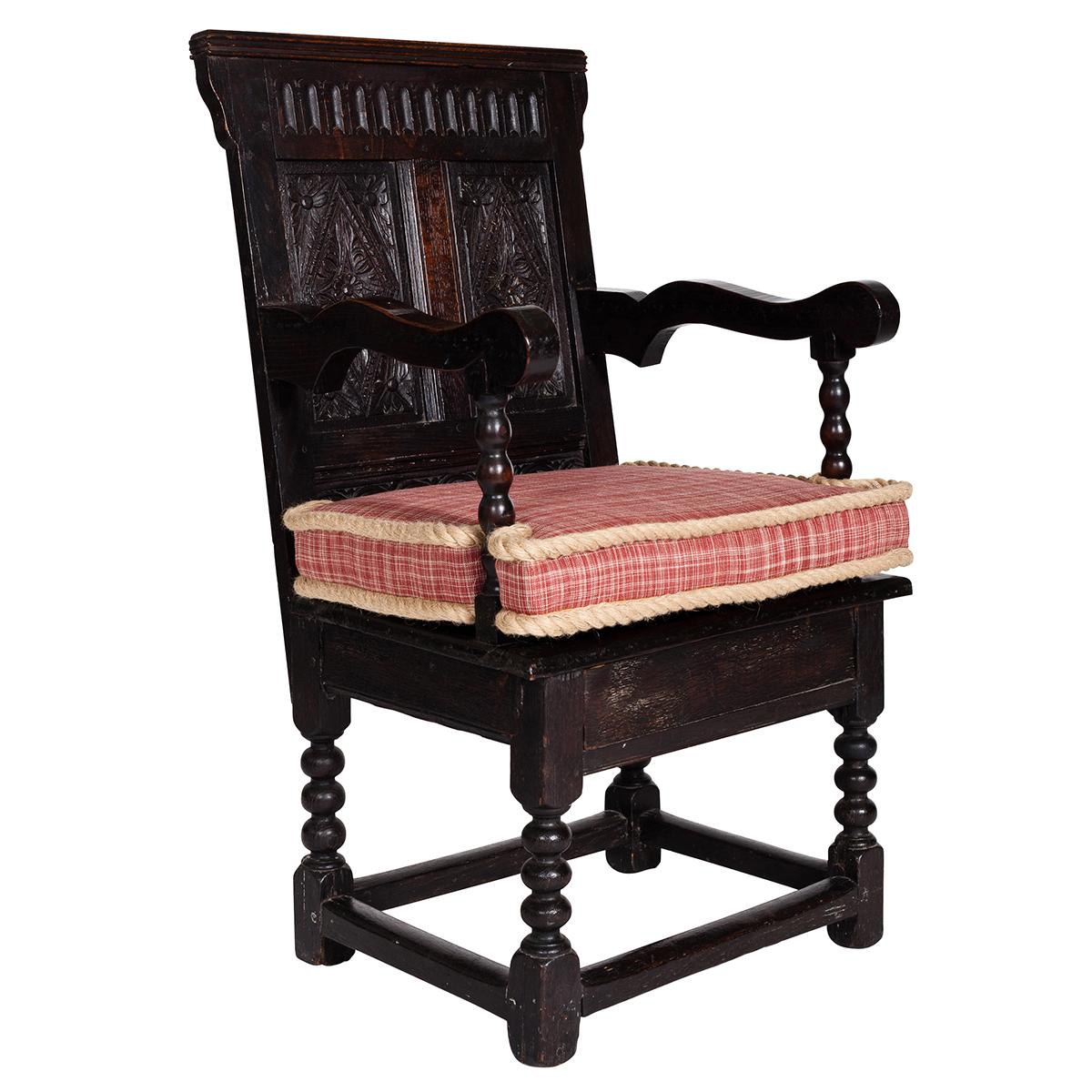 Crafted by joiners in the 17th century, oak Wainscot chairs are immediately recognizable, with their broad, crested backs, extensive Gothic-style carving, and blocky joints. Early inhabitants of Colonial America, along with the first settlers,