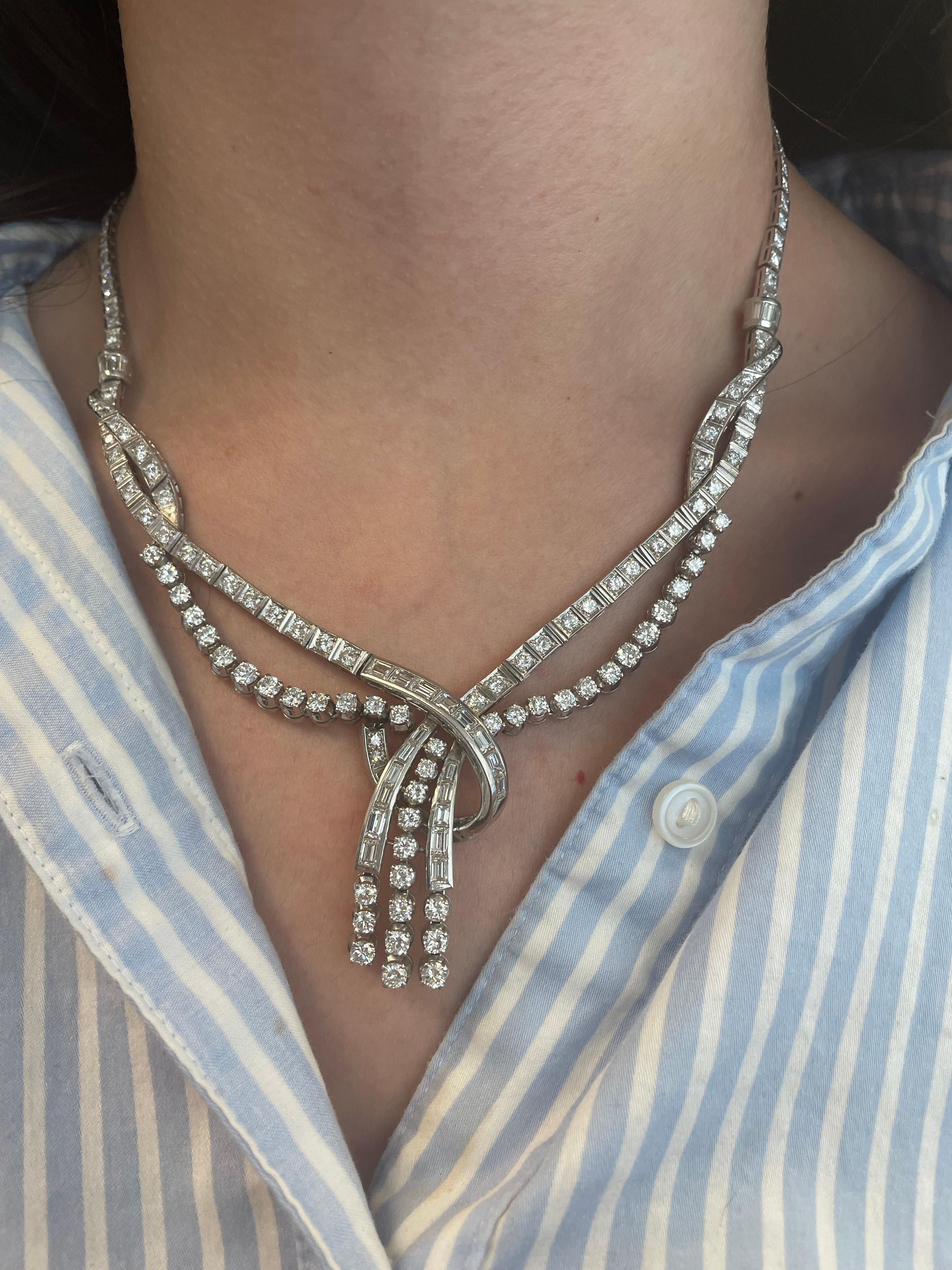 Grand statement lay-over diamonds high jewelry necklace.
Approximately 18.80 carats of round brilliant and baguette cut diamonds, approximately G/H color and VS clarity. Platinum, 16 inches.
Accommodated with an up-to-date appraisal by a GIA G.G.